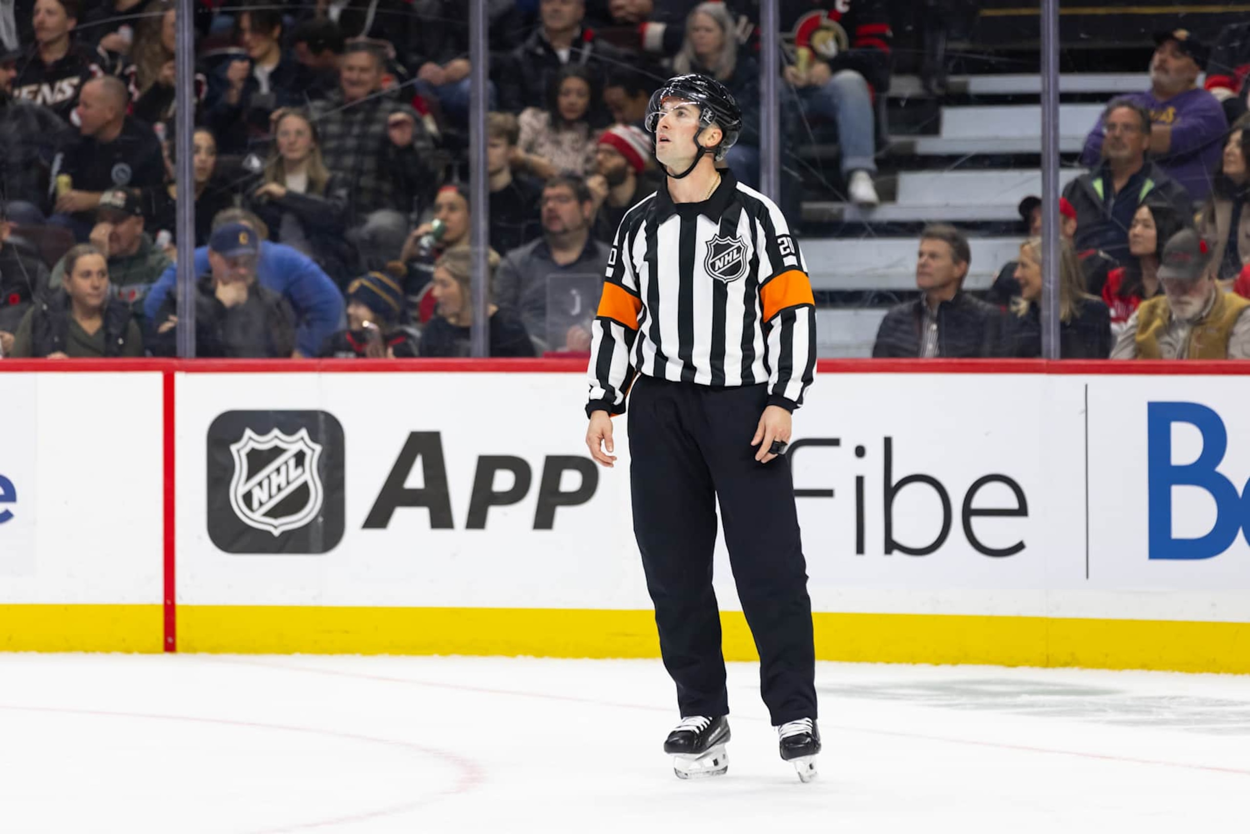 OTTAWA, ON - NOVEMBER 07: Referee Mitch Dunning (20) before a face-off during second period National Hockey League action between the New York Islanders and Ottawa Senators on November 7, 2024, at Canadian Tire Centre in Ottawa, ON, Canada. (Photo by Richard A. Whittaker/Icon Sportswire via Getty Images)
