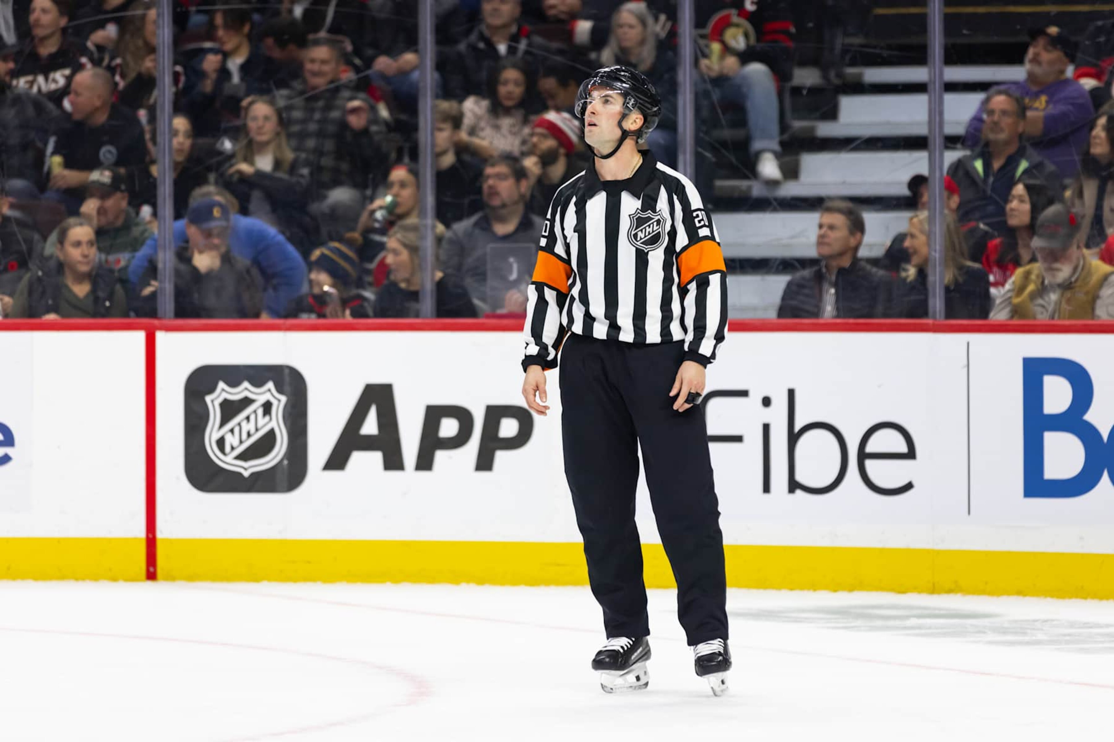 OTTAWA, ON - NOVEMBER 07: Referee Mitch Dunning (20) before a face-off during second period National Hockey League action between the New York Islanders and Ottawa Senators on November 7, 2024, at Canadian Tire Centre in Ottawa, ON, Canada. (Photo by Richard A. Whittaker/Icon Sportswire via Getty Images)