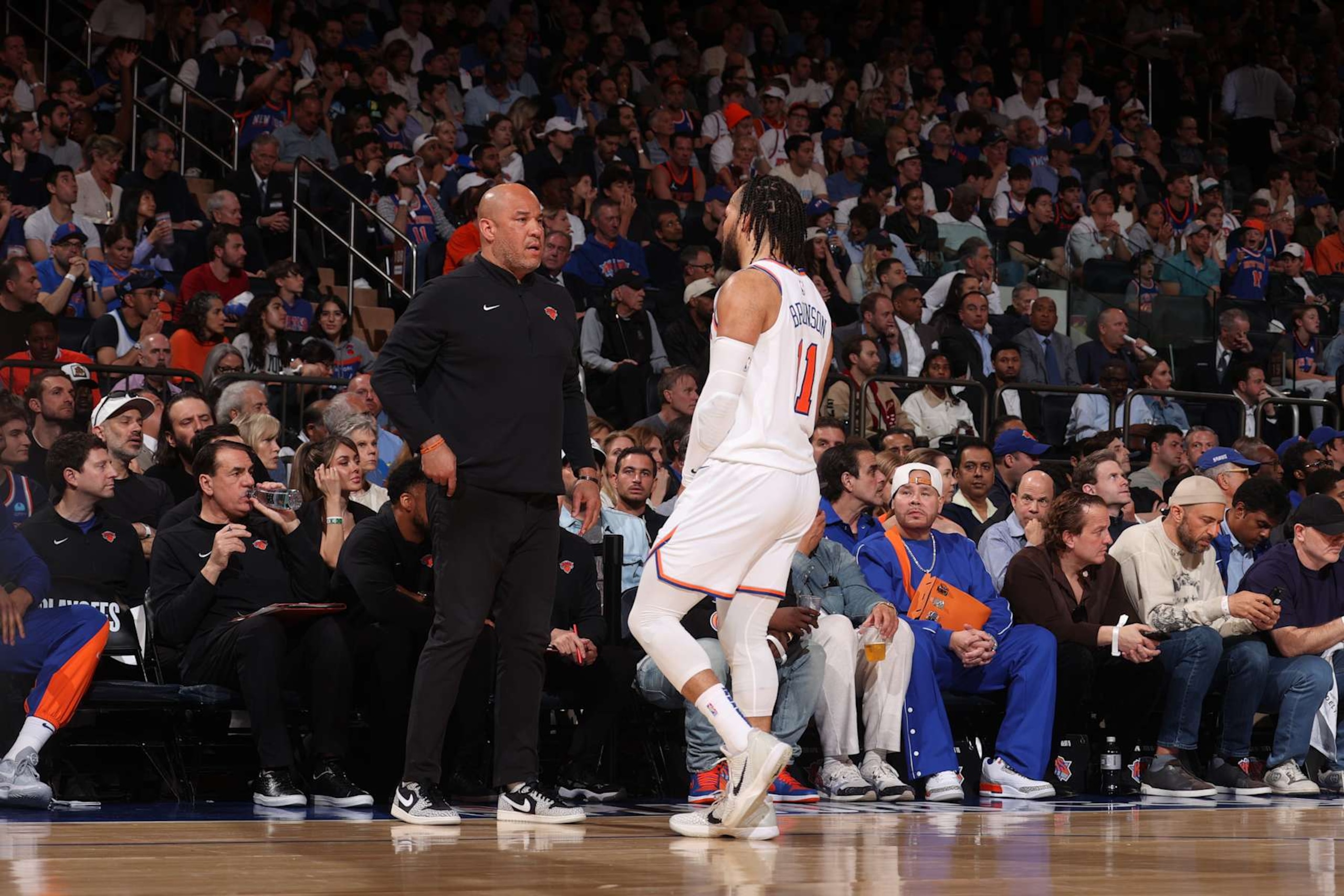 NEW YORK, NY - MAY 19: Rick Brunson talks to Jalen Brunson #11 of the New York Knicks during the game against the Indiana Pacers  during Round 2 Game 7 of the 2024 NBA Playoffs on May 19, 2024 at Madison Square Garden in New York City, New York.  NOTE TO USER: User expressly acknowledges and agrees that, by downloading and or using this photograph, User is consenting to the terms and conditions of the Getty Images License Agreement. Mandatory Copyright Notice: Copyright 2024 NBAE  (Photo by Nathaniel S. Butler/NBAE via Getty Images)