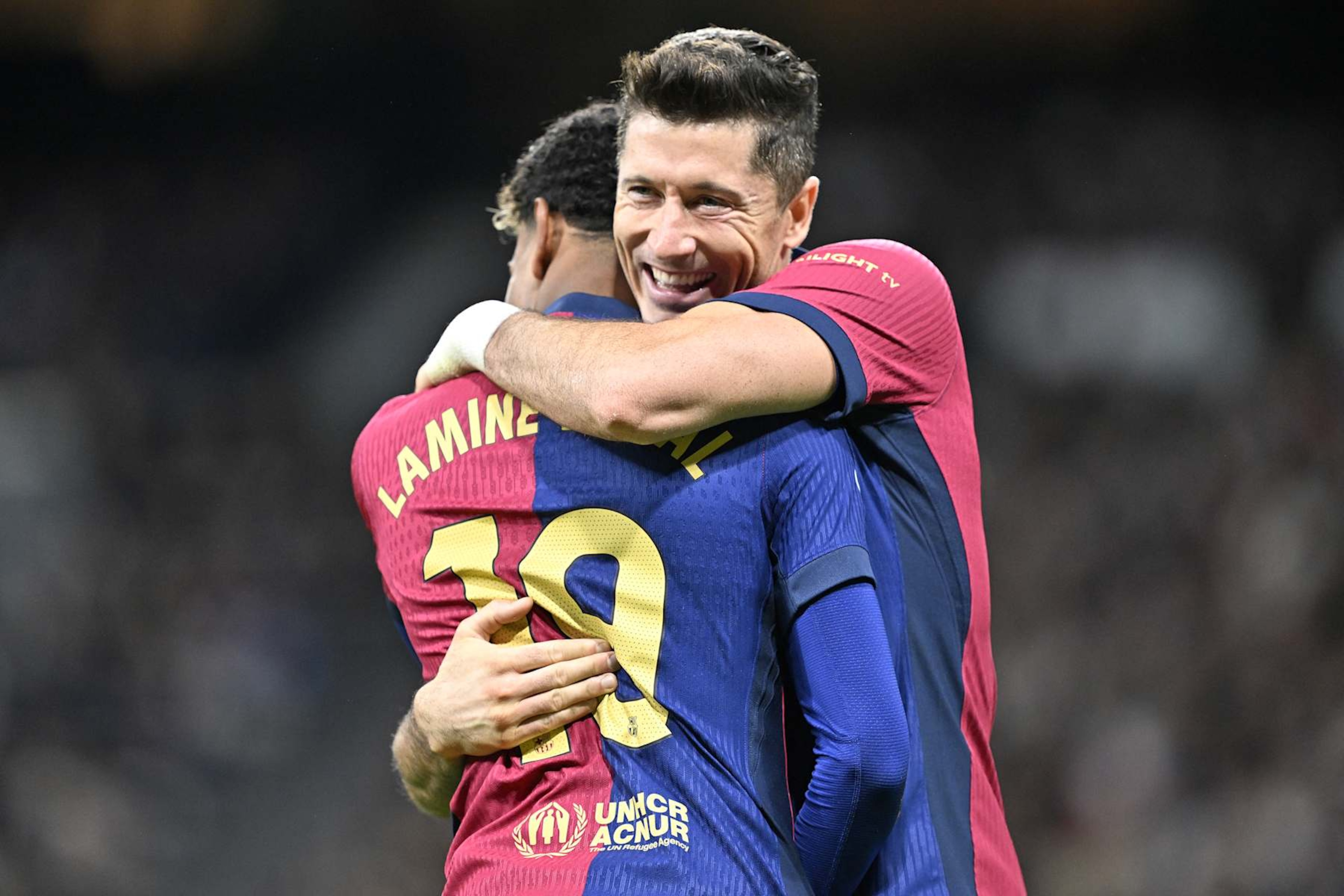 MADRID, SPAIN - OCTOBER 26: Lamine Yamal of Barcelona celebrates with Robert Lewandowski after scoring a goal during LaLiga football match between Real Madrid and Barcelona at Santiago Bernabeu in Madrid, Spain on October 26, 2024. (Photo by Burak Akbulut/Anadolu via Getty Images) MADRID, SPAIN - OCTOBER 26: Lamine Yamal of Barcelona celebrates with Robert Lewandowski after scoring a goal during LaLiga football match between Real Madrid and Barcelona at Santiago Bernabeu in Madrid, Spain on October 26, 2024. (Photo by Burak Akbulut/Anadolu via Getty Images)