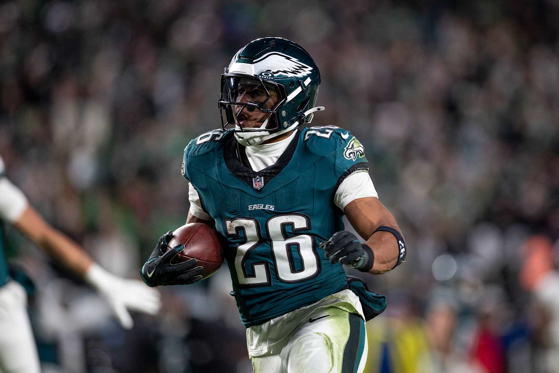 PHILADELPHIA, PENNSYLVANIA - NOVEMBER 14: Saquon Barkley #26 of the Philadelphia Eagles runs with the ball and scores a touchdown during an NFL Football game against the Washington Commanders at Lincoln Financial Field on November 14, 2024 in Philadelphia, Pennsylvania. (Photo by Michael Owens/Getty Images)