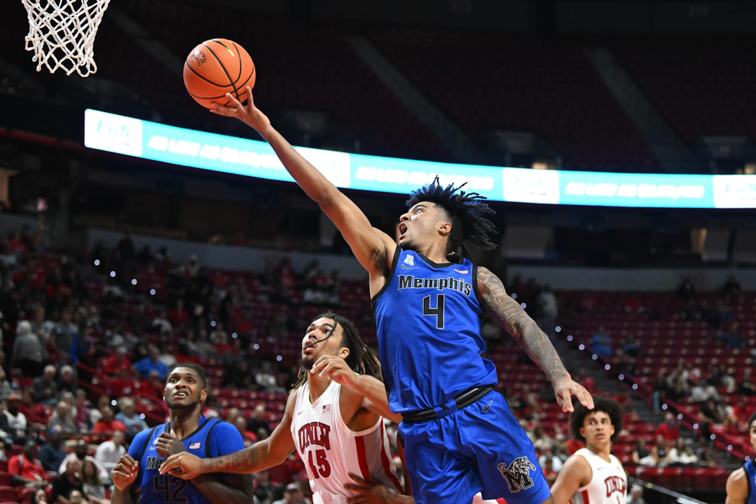 LAS VEGAS, NEVADA - NOVEMBER 09: PJ Haggerty #4 of the Memphis Tigers misses a layup against the UNLV Rebels in the second half of their game at the Thomas & Mack Center on November 09, 2024 in Las Vegas, Nevada. Tigers defeated the Rebels 80-74. (Photo by Candice Ward/Getty Images)