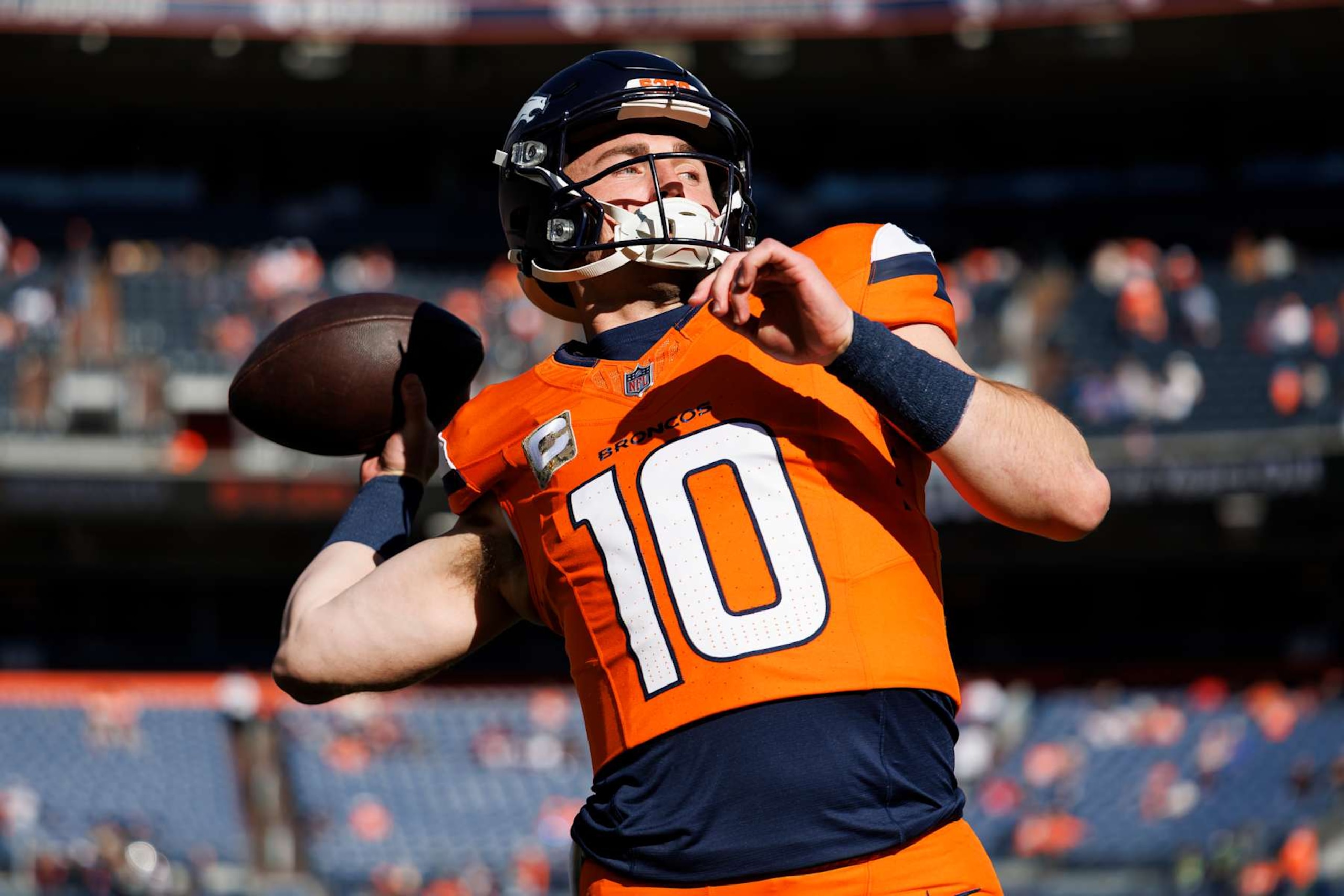 DENVER, COLORADO - NOVEMBER 17: Quarterback Bo Nix #10 of the Denver Broncos warms up prior to an NFL football game against the Atlanta Falcons, at Empower Field at Mile High on November 17, 2024 in Denver, Colorado. (Photo by Brooke Sutton/Getty Images) DENVER, COLORADO - NOVEMBER 17: Quarterback Bo Nix #10 of the Denver Broncos warms up prior to an NFL football game against the Atlanta Falcons, at Empower Field at Mile High on November 17, 2024 in Denver, Colorado. (Photo by Brooke Sutton/Getty Images)