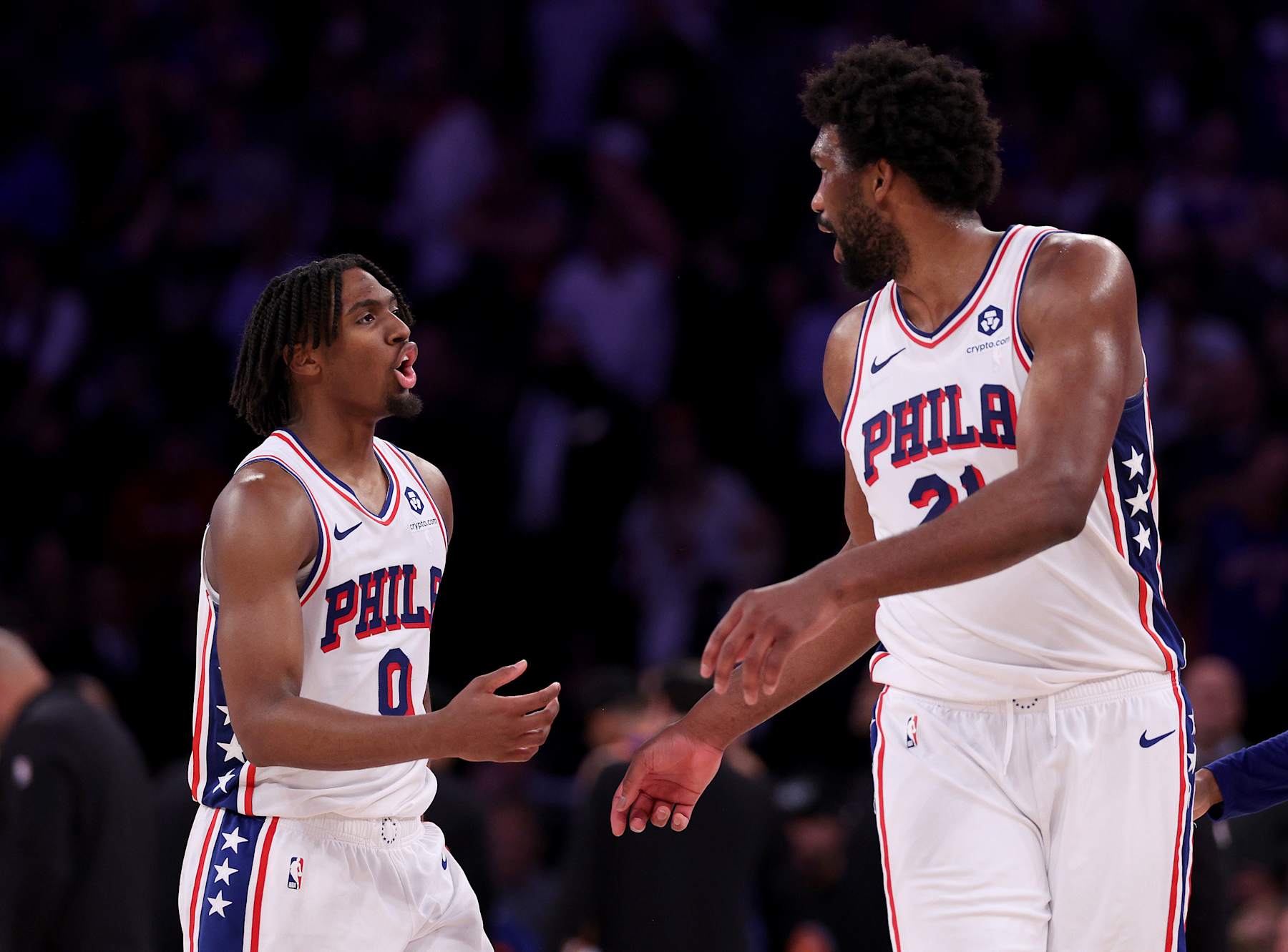 NEW YORK, NEW YORK - APRIL 30: Tyrese Maxey #0 and Joel Embiid #21 of the Philadelphia 76ers talk during the second half against the New York Knicks at Madison Square Garden on April 30, 2024 in New York City. The Philadelphia 76ers defeated the New York Knicks 112-106 in overtime. NOTE TO USER: User expressly acknowledges and agrees that, by downloading and or using this photograph, User is consenting to the terms and conditions of the Getty Images License Agreement. (Photo by Elsa/Getty Images)
