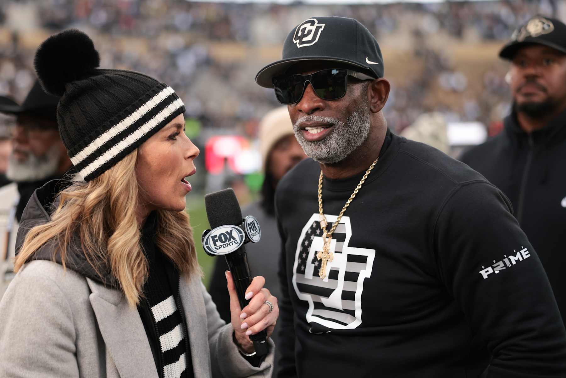 BOULDER, COLORADO - NOVEMBER 16: Head coach Deion Sanders of the Colorado Buffaloes is interviewed by Jenny Taft after the game against the Utah Utes at Folsom Field on November 16, 2024 in Boulder, Colorado. (Photo by Andrew Wevers/Getty Images)