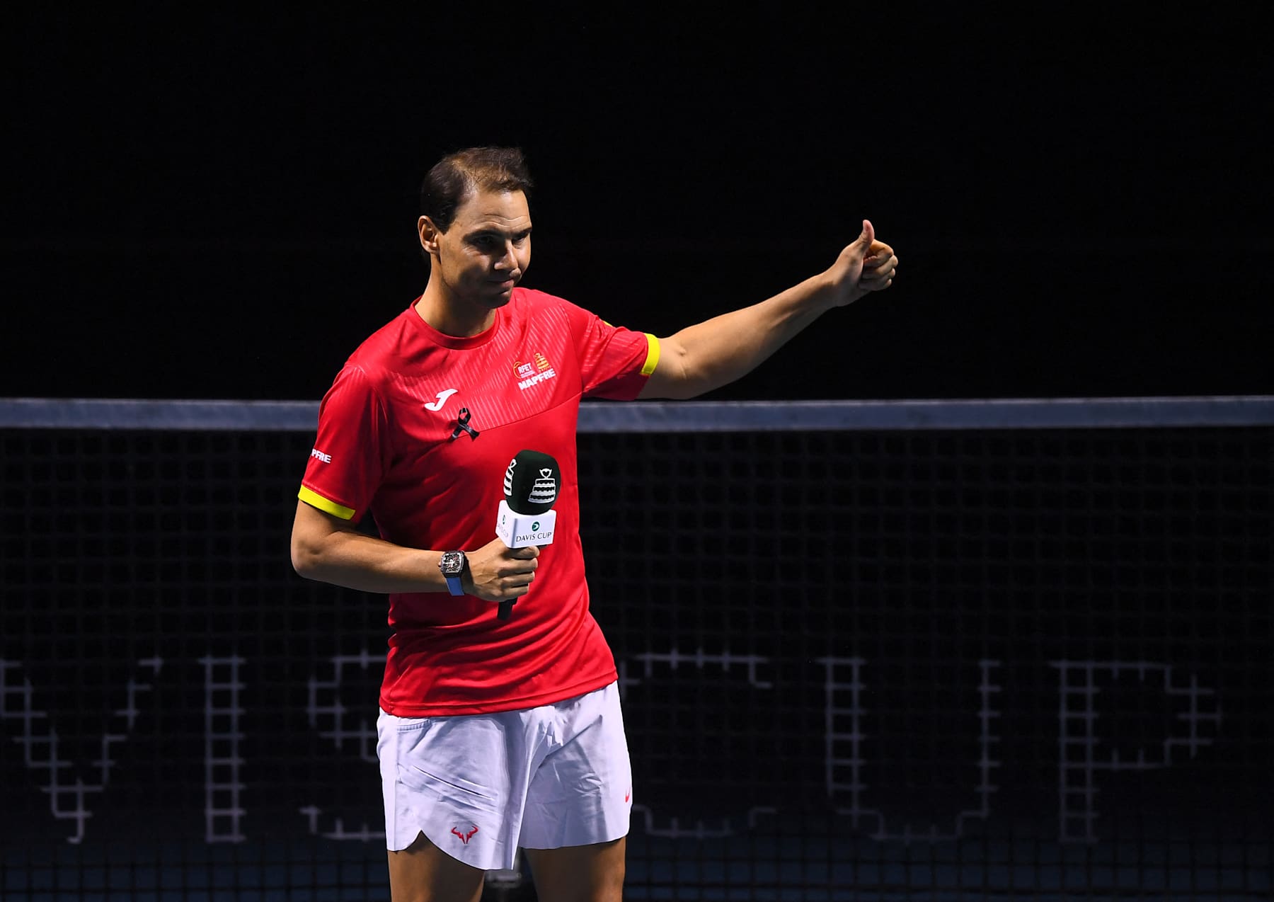 Spain's Rafael Nadal talks during a tribute to his career at the end of the quarter-final doubles match between Netherlands and Spain during the Davis Cup Finals at the Palacio de Deportes Jose Maria Martin Carpena arena in Malaga, southern Spain, on November 19, 2024. Superstar Rafael Nadal's glittering career in professional tennis came to an end on November 19, 2024 as Netherlands eliminated Spain in the Davis Cup quarter-finals. (Photo by Jorge GUERRERO / AFP) (Photo by JORGE GUERRERO/AFP via Getty Images)