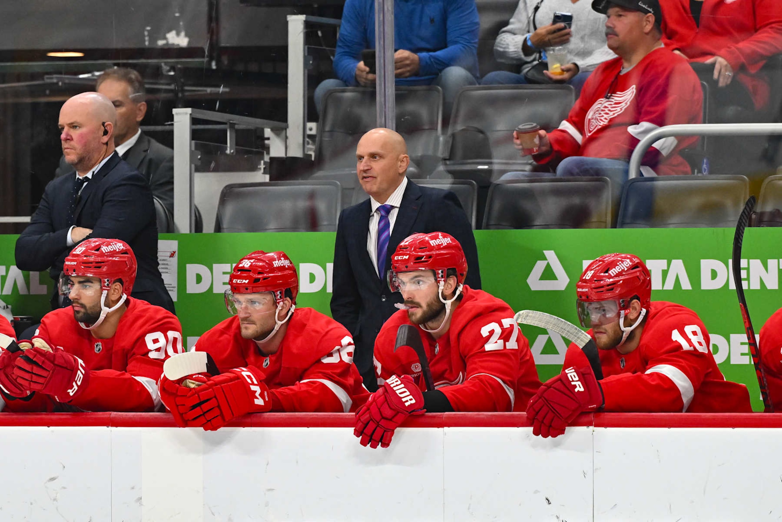 DETROIT, MI - OCTOBER 24: Detroit Red Wings head coach Derek Lalonde watches play from behind the bench in the first period during the game between the Detroit Red Wings and the New Jersey Devils Thursday October 24, 2024 at Little Caesars Arena in Detroit, MI. (Photo by Steven King/Icon Sportswire via Getty Images)