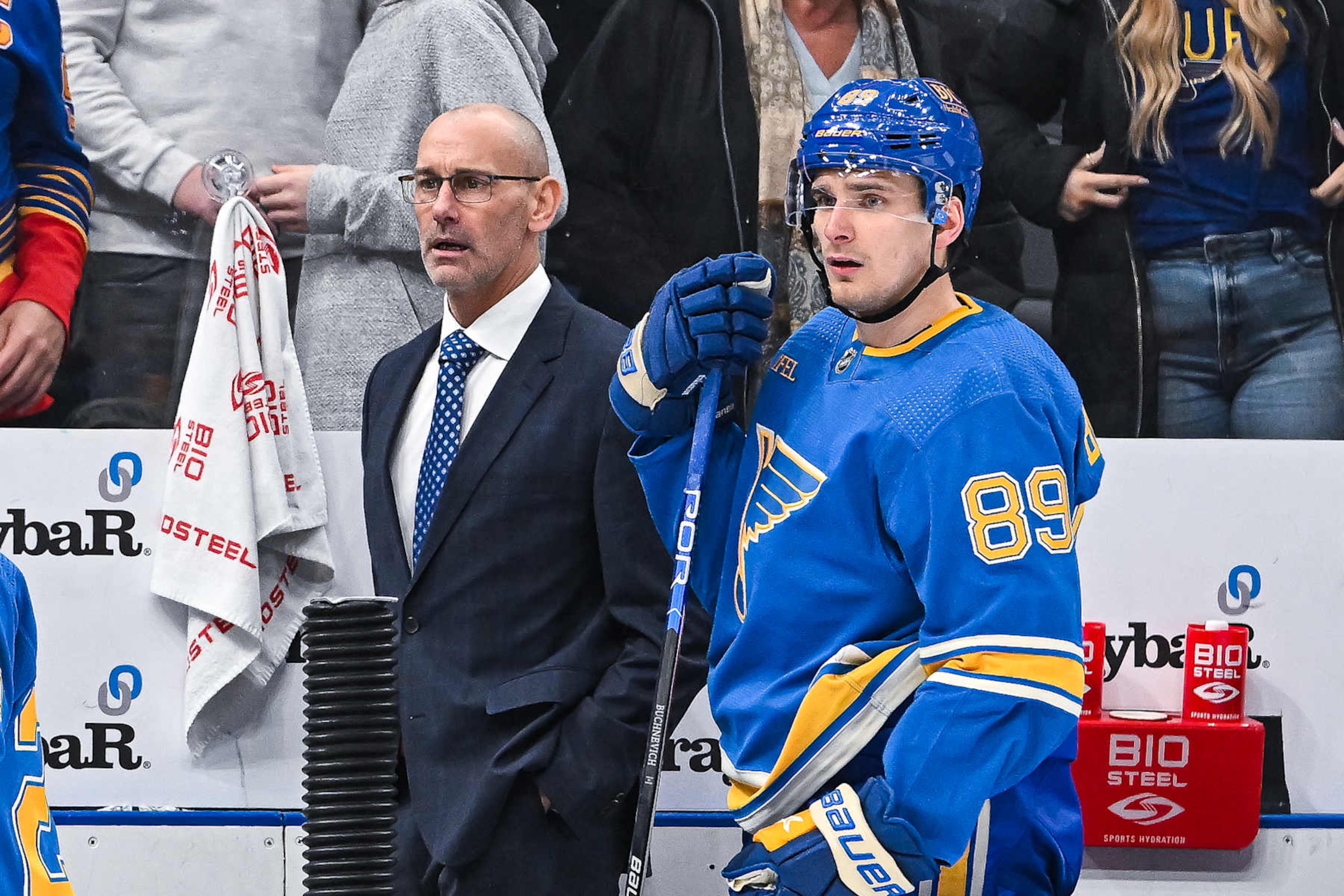 ST. LOUIS, MO - January 13: St. Louis Blues head Coach Drew Bannister and St. Louis Blues left wing Pavel Buchnevich (89) look on in disbelief at the officials for a missed trip call that led to their team giving up the winning goal in overtime during a regular season game between the Boston Bruins and the St. Louis Blues on January 13, 2024, at the Enterprise Center in St. Louis MO (Photo by Rick Ulreich/Icon Sportswire via Getty Images)