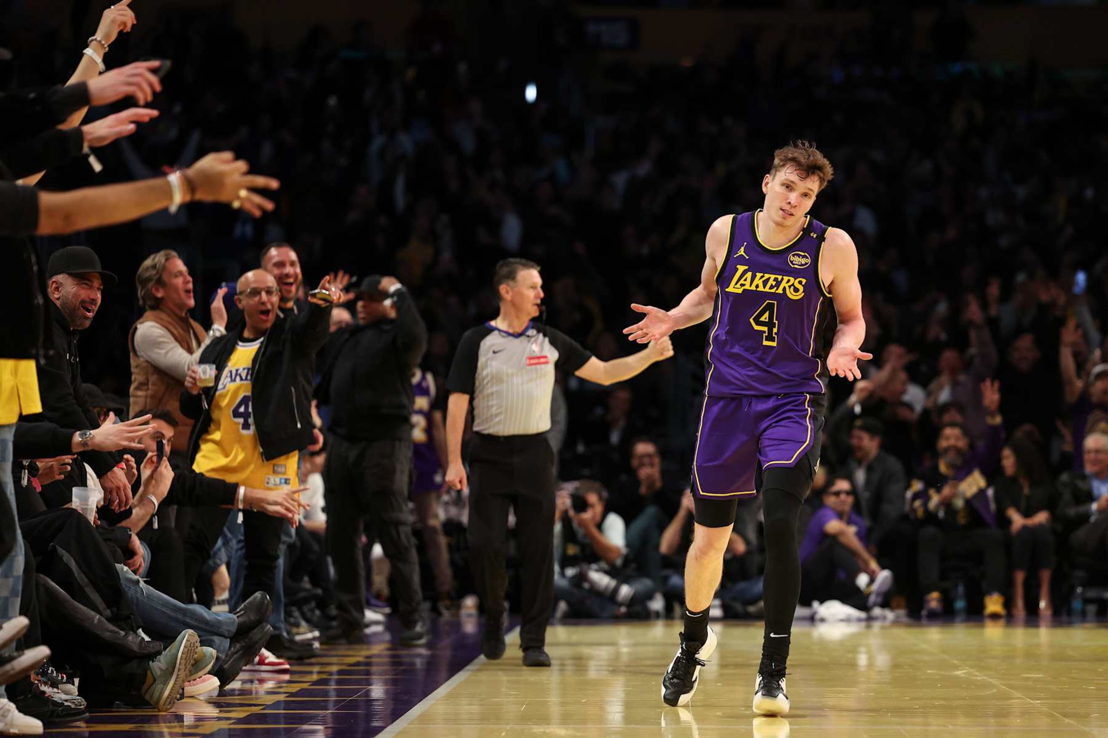 LOS ANGELES, CALIFORNIA - NOVEMBER 19: Dalton Knecht #4 of the Los Angeles Lakers reacts after scoring his fourth consecutive 3-point basket against the Utah Jazz during the third quarter of the Emirates NBA Cup at Crypto.com Arena on November 19, 2024 in Los Angeles, California. NOTE TO USER: User expressly acknowledges and agrees that, by downloading and or using this photograph, User is consenting to the terms and conditions of the Getty Images License Agreement. (Photo by Harry How/Getty Images) LOS ANGELES, CALIFORNIA - NOVEMBER 19: Dalton Knecht #4 of the Los Angeles Lakers reacts after scoring his fourth consecutive 3-point basket against the Utah Jazz during the third quarter of the Emirates NBA Cup at Crypto.com Arena on November 19, 2024 in Los Angeles, California. NOTE TO USER: User expressly acknowledges and agrees that, by downloading and or using this photograph, User is consenting to the terms and conditions of the Getty Images License Agreement. (Photo by Harry How/Getty Images)