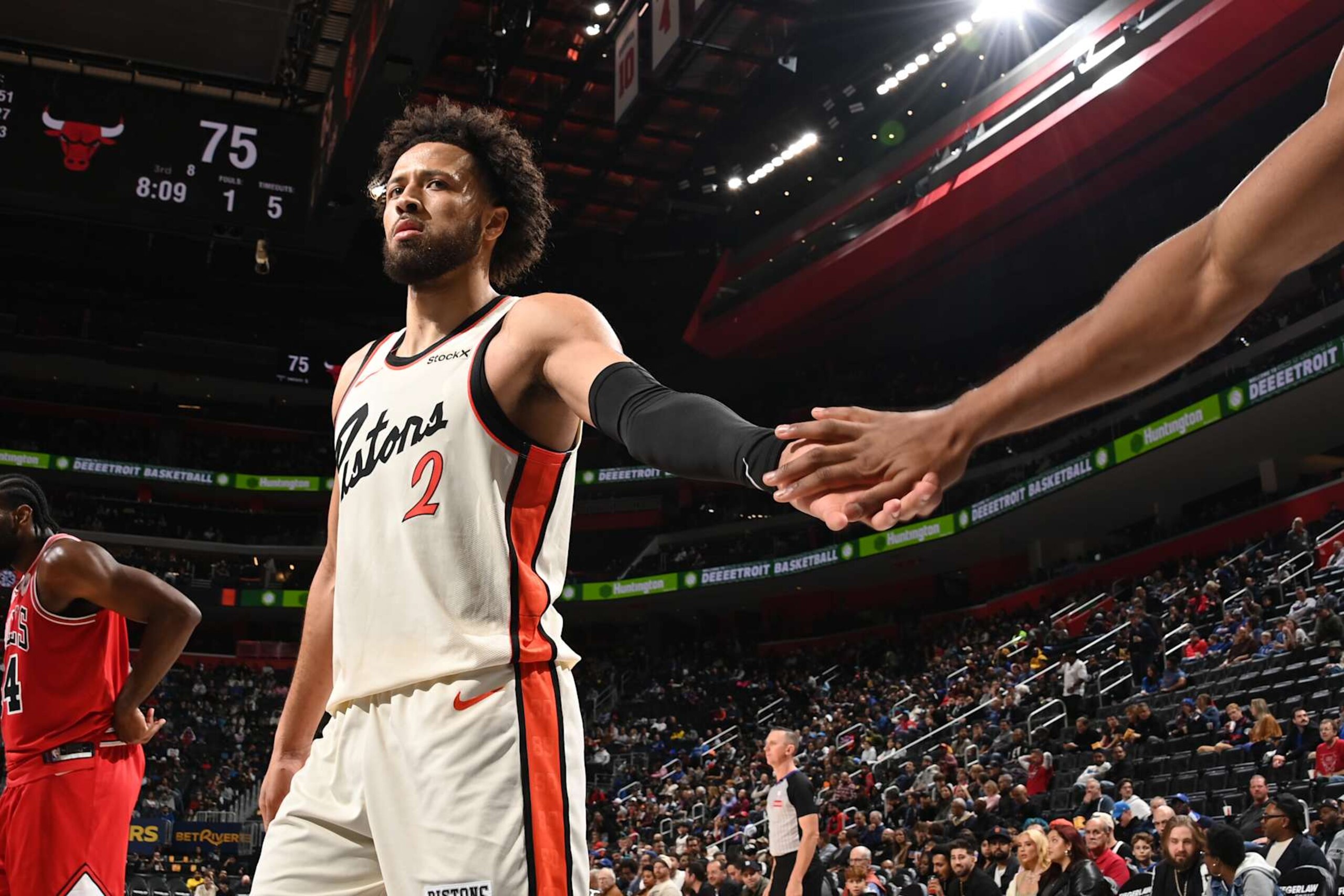 DETROIT, MI - NOVEMBER 18: Cade Cunningham #2 of the Detroit Pistons high fives during the game against the Chicago Bulls on November 18, 2024 at Little Caesars Arena in Detroit, Michigan. NOTE TO USER: User expressly acknowledges and agrees that, by downloading and/or using this photograph, User is consenting to the terms and conditions of the Getty Images License Agreement. Mandatory Copyright Notice: Copyright 2024 NBAE (Photo by Chris Schwegler/NBAE via Getty Images)