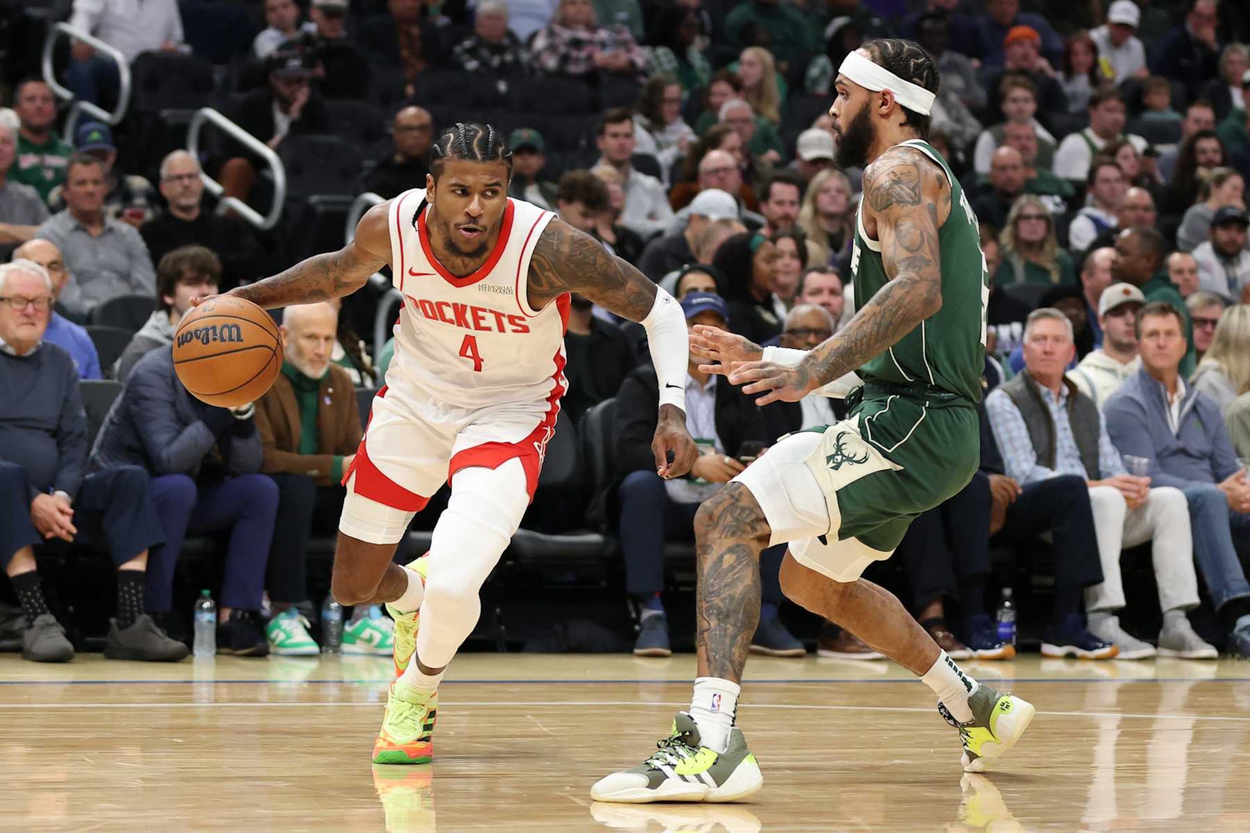 MILWAUKEE, WISCONSIN - NOVEMBER 18: Jalen Green #4 of the Houston Rockets drives around Gary Trent Jr. #5 of the Milwaukee Bucks during a game at Fiserv Forum on November 18, 2024 in Milwaukee, Wisconsin. NOTE TO USER: User expressly acknowledges and agrees that, by downloading and or using this photograph, User is consenting to the terms and conditions of the Getty Images License Agreement. (Photo by Stacy Revere/Getty Images)