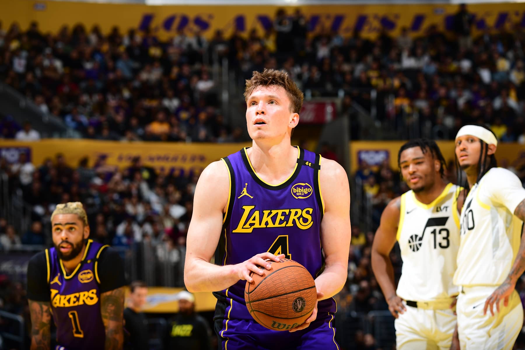 LOS ANGELES, CA - NOVEMBER 19: Dalton Knecht #4 of the Los Angeles Lakers shoots a free throw during the game against the Utah Jazz during the Emirates NBA Cup game on November 19, 2024 at Crypto.Com Arena in Los Angeles, California. NOTE TO USER: User expressly acknowledges and agrees that, by downloading and/or using this Photograph, user is consenting to the terms and conditions of the Getty Images License Agreement. Mandatory Copyright Notice: Copyright 2024 NBAE (Photo by Adam Pantozzi/NBAE via Getty Images)