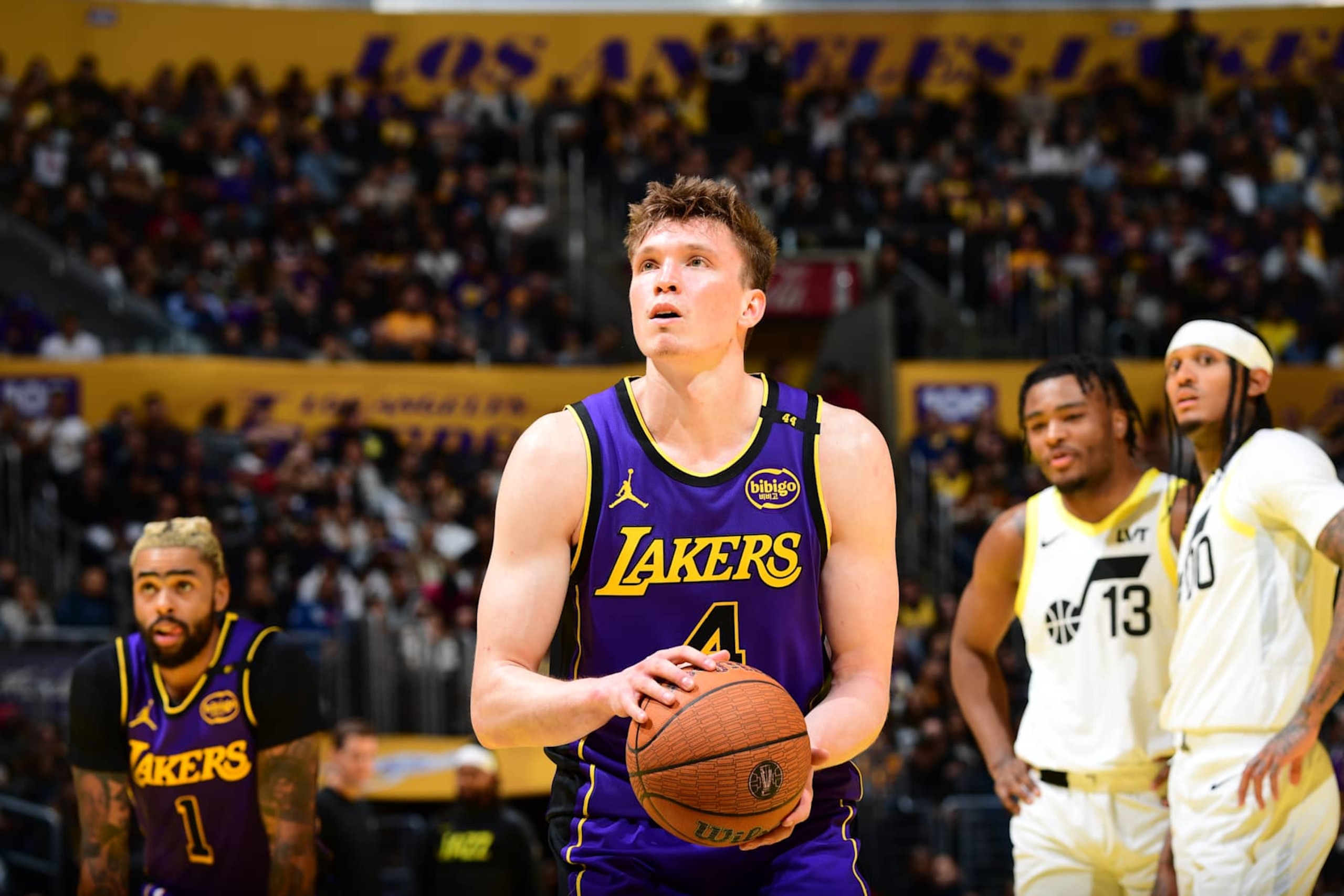 LOS ANGELES, CA - NOVEMBER 19: Dalton Knecht #4 of the Los Angeles Lakers shoots a free throw during the game against the Utah Jazz during the Emirates NBA Cup game on November 19, 2024 at Crypto.Com Arena in Los Angeles, California. NOTE TO USER: User expressly acknowledges and agrees that, by downloading and/or using this Photograph, user is consenting to the terms and conditions of the Getty Images License Agreement. Mandatory Copyright Notice: Copyright 2024 NBAE (Photo by Adam Pantozzi/NBAE via Getty Images)
