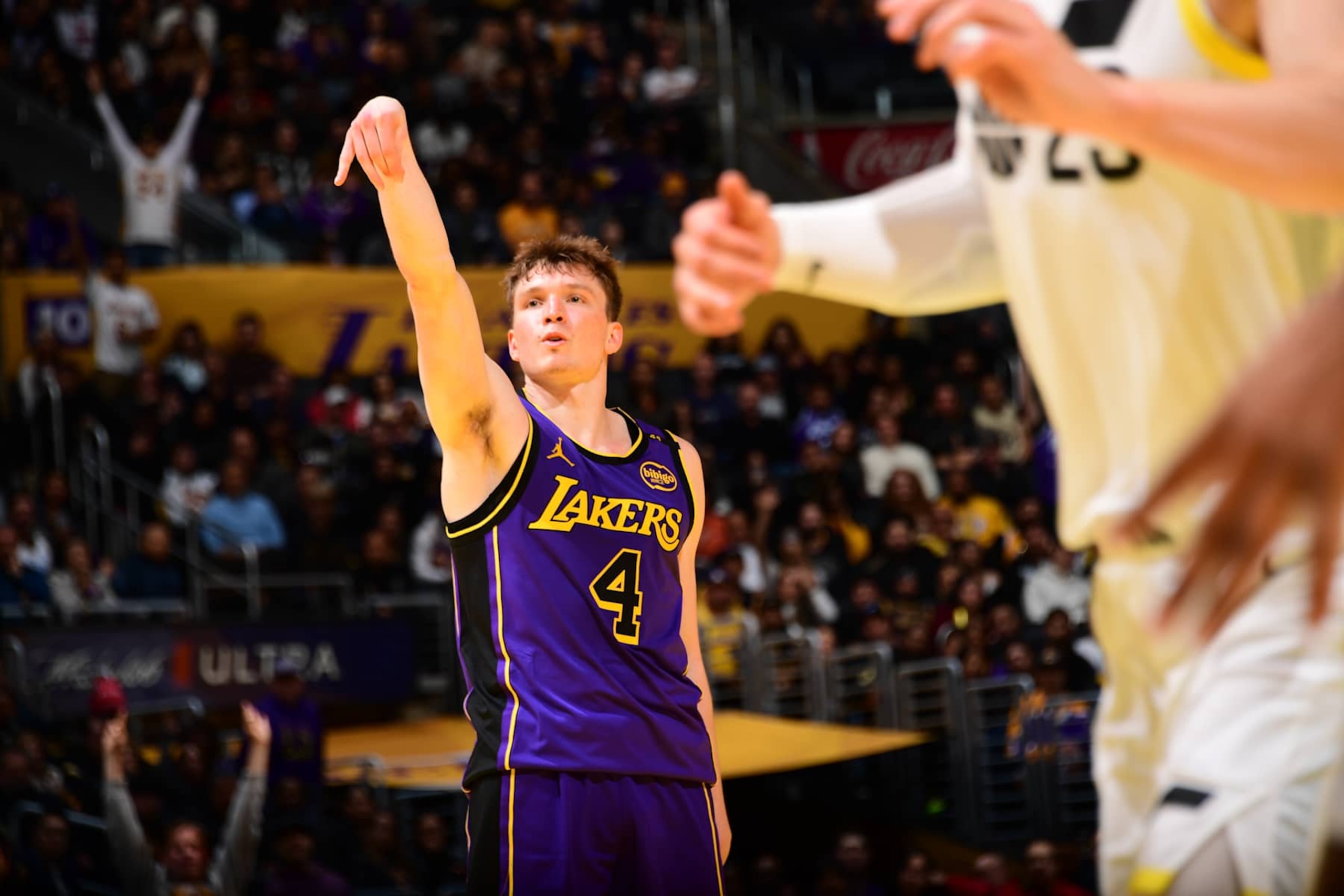 LOS ANGELES, CA - NOVEMBER 19: Dalton Knecht #4 of the Los Angeles Lakers looks on during the game against the Utah Jazz during the Emirates NBA Cup game on November 19, 2024 at Crypto.Com Arena in Los Angeles, California. NOTE TO USER: User expressly acknowledges and agrees that, by downloading and/or using this Photograph, user is consenting to the terms and conditions of the Getty Images License Agreement. Mandatory Copyright Notice: Copyright 2024 NBAE (Photo by Adam Pantozzi/NBAE via Getty Images)