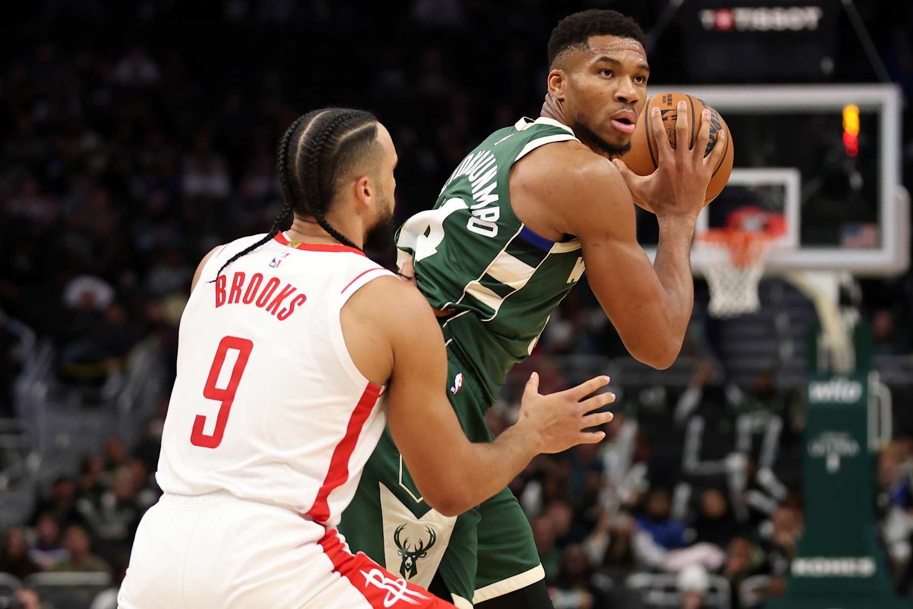 MILWAUKEE, WISCONSIN - NOVEMBER 18: Giannis Antetokounmpo #34 of the Milwaukee Bucks is defended by Dillon Brooks #9 of the Houston Rockets during the second half of a game at Fiserv Forum on November 18, 2024 in Milwaukee, Wisconsin. NOTE TO USER: User expressly acknowledges and agrees that, by downloading and or using this photograph, User is consenting to the terms and conditions of the Getty Images License Agreement. (Photo by Stacy Revere/Getty Images)