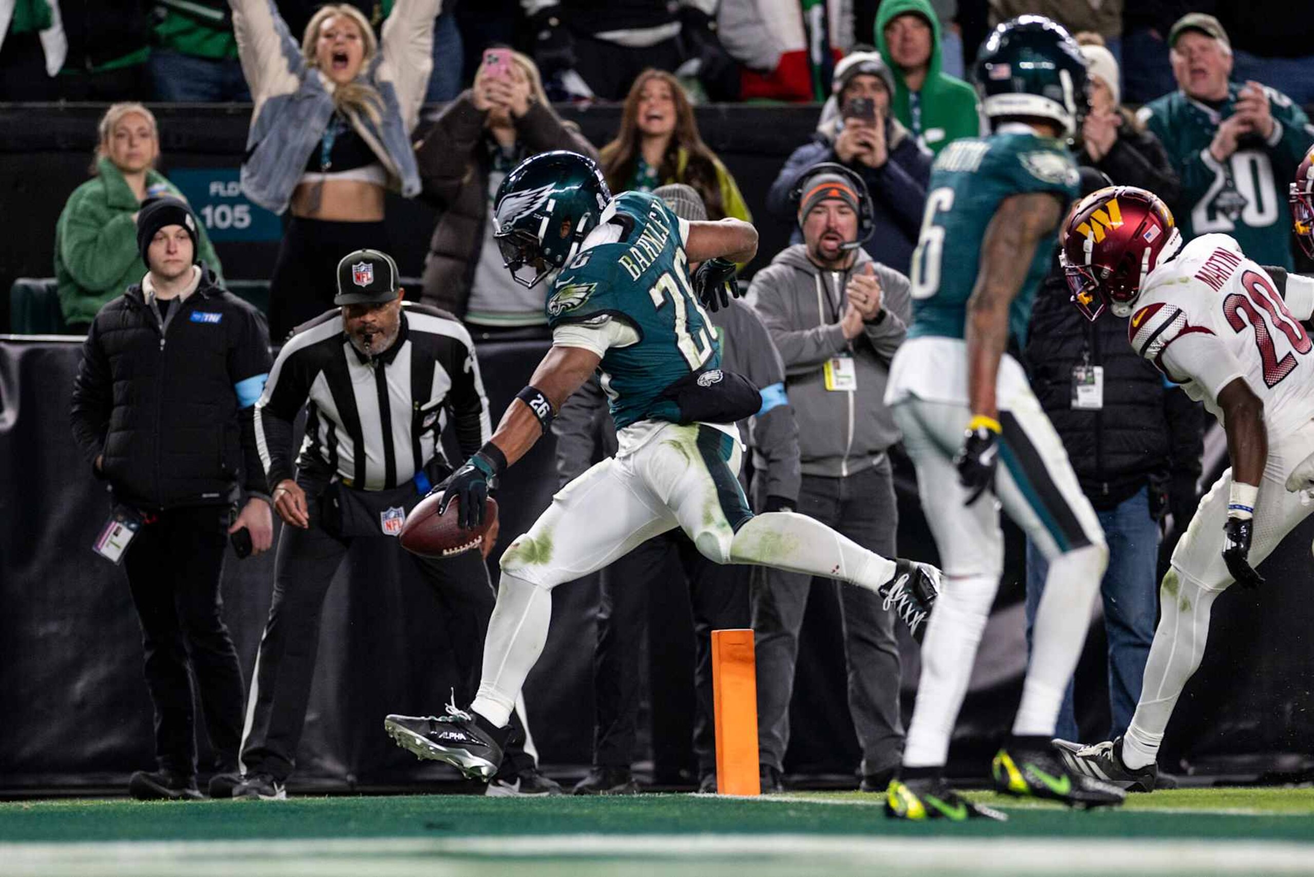 PHILADELPHIA, PENNSYLVANIA - NOVEMBER 14: Saquon Barkley #26 of the Philadelphia Eagles runs with the ball and scores a touchdown during an NFL Football game against the Washington Commanders at Lincoln Financial Field on November 14, 2024 in Philadelphia, Pennsylvania. (Photo by Michael Owens/Getty Images) PHILADELPHIA, PENNSYLVANIA - NOVEMBER 14: Saquon Barkley #26 of the Philadelphia Eagles runs with the ball and scores a touchdown during an NFL Football game against the Washington Commanders at Lincoln Financial Field on November 14, 2024 in Philadelphia, Pennsylvania. (Photo by Michael Owens/Getty Images)