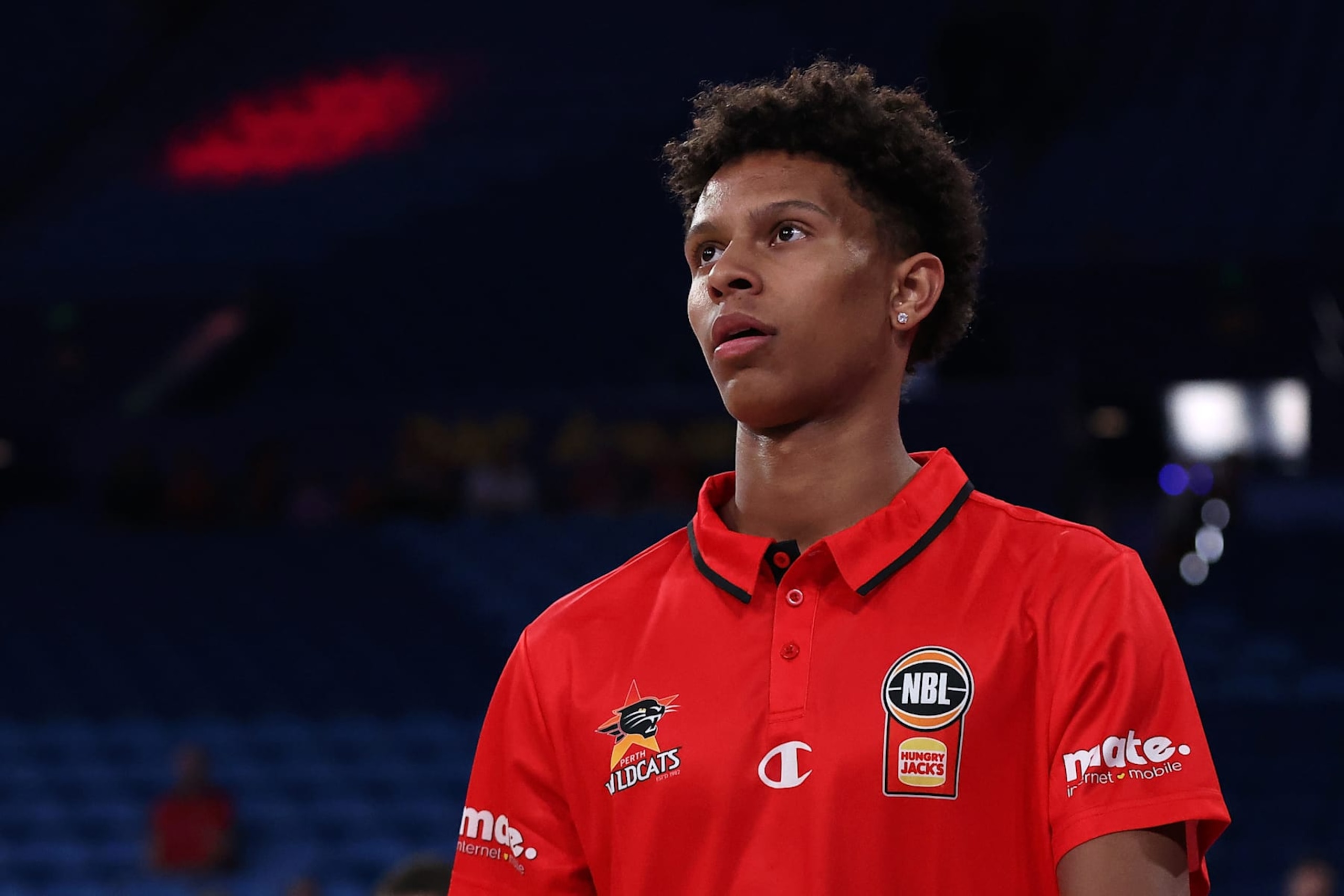 PERTH, AUSTRALIA - OCTOBER 25: Dash Daniels looks on as players warm up during the round six NBL match between Perth Wildcats and Sydney Kings at RAC Arena, on October 25, 2024, in Perth, Australia. (Photo by Paul Kane/Getty Images)