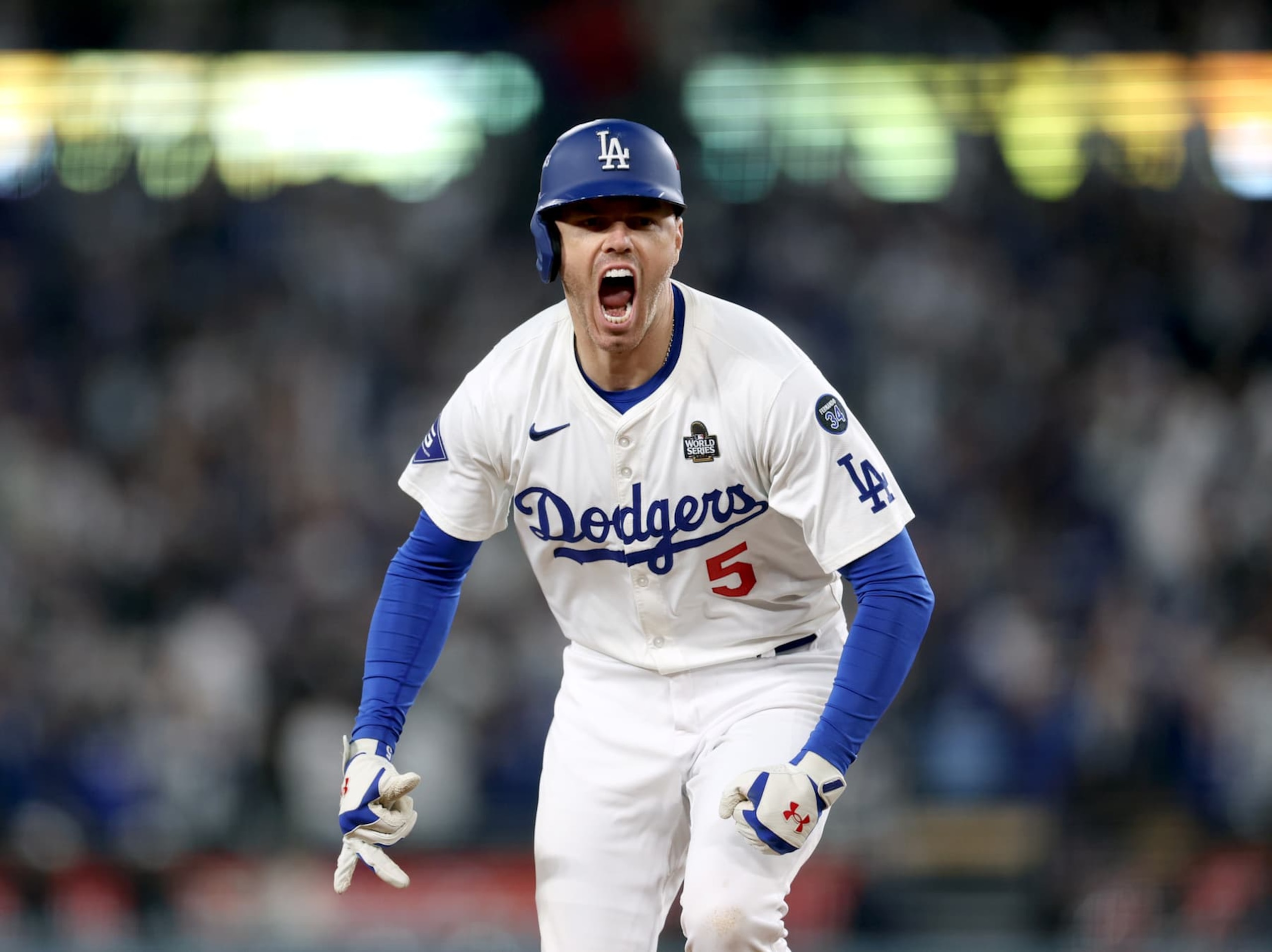 LOS ANGELES, CALIFORNIA - OCTOBER 25: Freddie Freeman #5 of the Los Angeles Dodgers celebrates after hitting a walk-off grand slam during the tenth inning, for a 6-3 win over the New York Yankees, during Game One of the 2024 World Series at Dodger Stadium on October 25, 2024 in Los Angeles, California. (Photo by Harry How/Getty Images)
