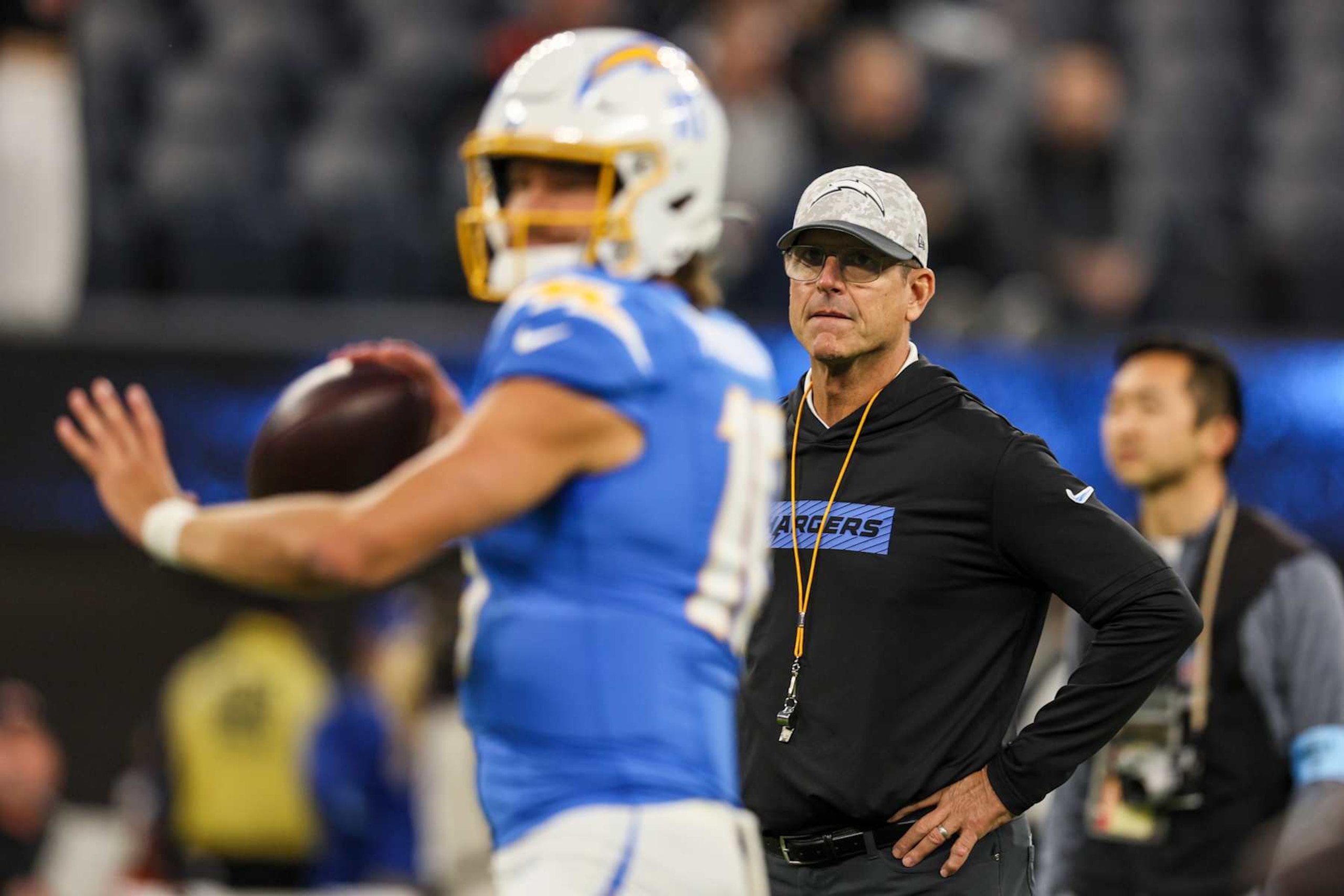 Inglewood, CA, Sunday, November 17, 2024 - Chargers head coach Jim Harbaugh watches Justin Herbert during pregame warmups before a game against the Cincinnati Bengals at SoFi Stadium. (Robert Gauthier/Los Angeles Times via Getty Images)
