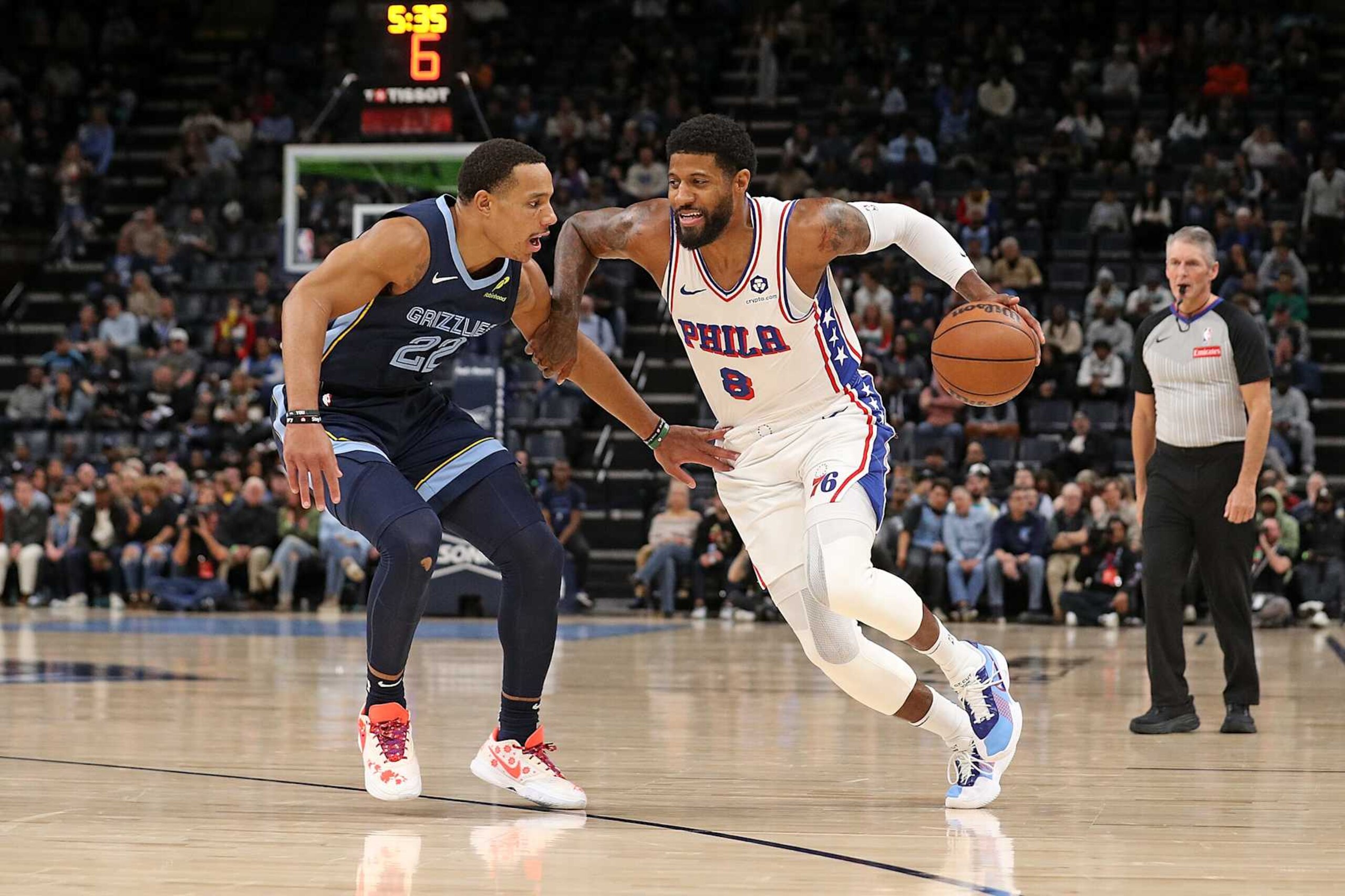 MEMPHIS, TENNESSEE - NOVEMBER 20: Paul George #8 of the Philadelphia 76ers drives to the basket against Desmond Bane #22 of the Memphis Grizzlies during the first half at FedExForum on November 20, 2024 in Memphis, Tennessee. NOTE TO USER: User expressly acknowledges and agrees that, by downloading and or using this photograph, User is consenting to the terms and conditions of the Getty Images License Agreement. (Photo by Justin Ford/Getty Images) MEMPHIS, TENNESSEE - NOVEMBER 20: Paul George #8 of the Philadelphia 76ers drives to the basket against Desmond Bane #22 of the Memphis Grizzlies during the first half at FedExForum on November 20, 2024 in Memphis, Tennessee. NOTE TO USER: User expressly acknowledges and agrees that, by downloading and or using this photograph, User is consenting to the terms and conditions of the Getty Images License Agreement. (Photo by Justin Ford/Getty Images)