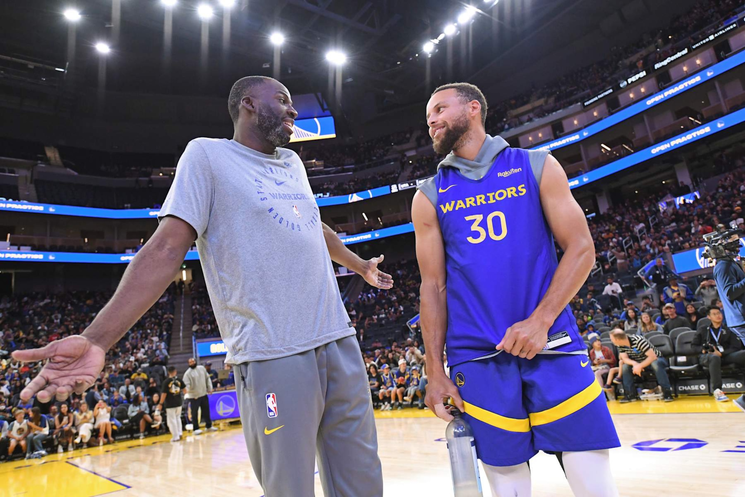 SAN FRANCISCO, CA - OCTOBER 16: Draymond Green #23 and Stephen Curry #30 of the Golden State Warriors talk before the Warriors Open Practice on October 16, 2024 at Chase Center in San Francisco, California. NOTE TO USER: User expressly acknowledges and agrees that, by downloading and or using this photograph, user is consenting to the terms and conditions of Getty Images License Agreement. Mandatory Copyright Notice: Copyright 2024 NBAE (Photo by Noah Graham/NBAE via Getty Images)