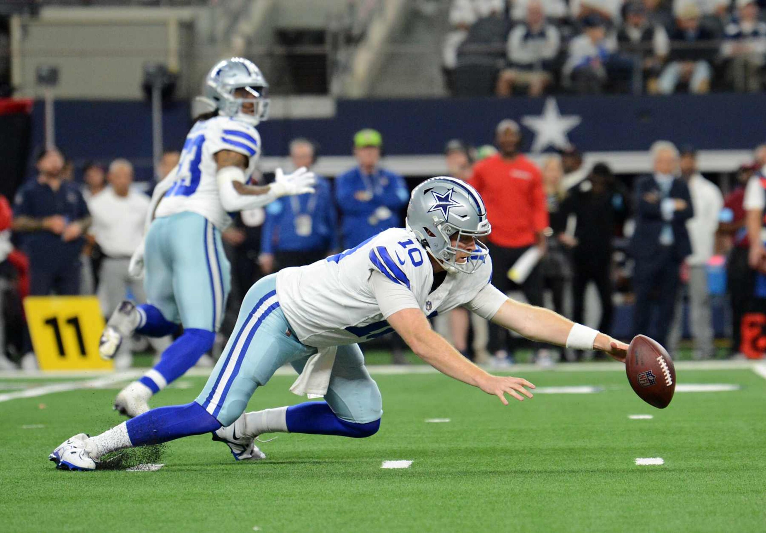 ARLINGTON, TX - NOVEMBER 18: Dallas Cowboys QB Cooper Rush fumbles a snap during game featuring the Houston Texans and the Dallas Cowboys on November 18, 2024 at AT&T Stadium in Arlington, TX. (Photo by John Rivera/Icon Sportswire via Getty Images)