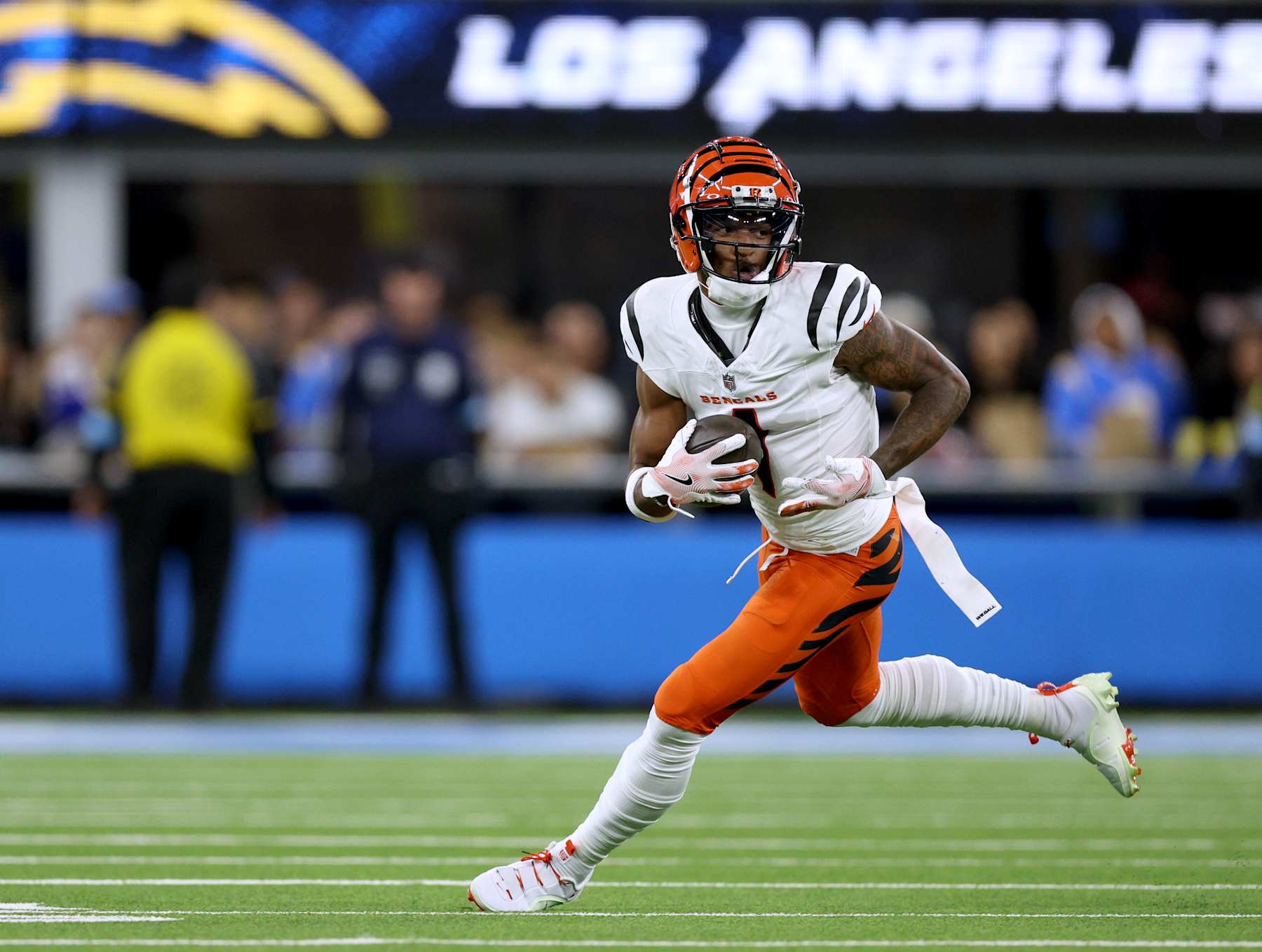 INGLEWOOD, CALIFORNIA - NOVEMBER 17: Ja'Marr Chase #1 of the Cincinnati Bengals runs after his catch during a 34-27 loss to the Los Angeles Chargers at SoFi Stadium on November 17, 2024 in Inglewood, California. (Photo by Harry How/Getty Images)