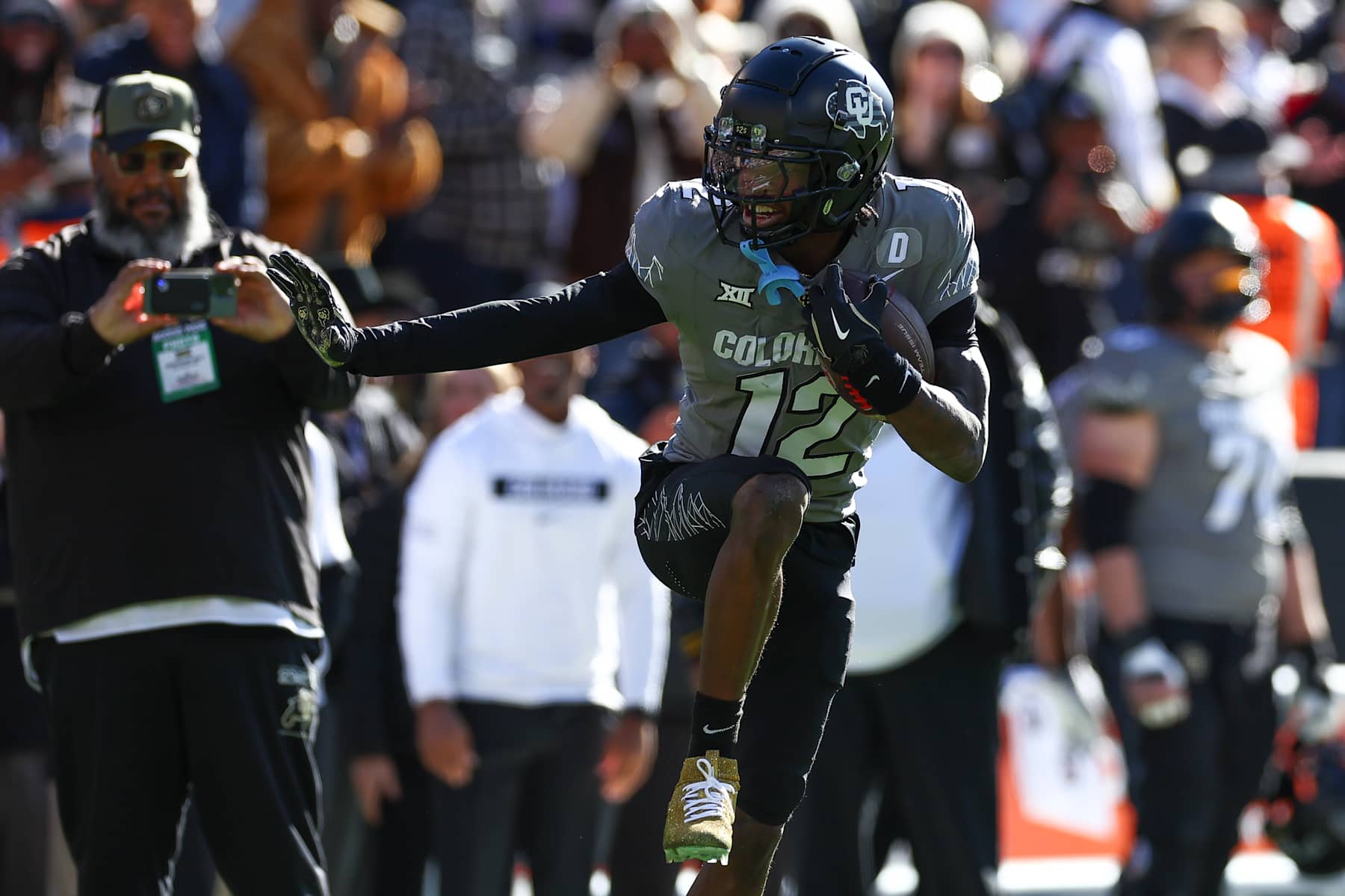 BOULDER, COLORADO - NOVEMBER 16: Travis Hunter #12 of the Colorado Buffaloes celebrates after an interception by striking the Heisman pose during the first half against the Utah Utes at Folsom Field on November 16, 2024 in Boulder, Colorado. (Photo by Aaron M. Sprecher/Getty Images)