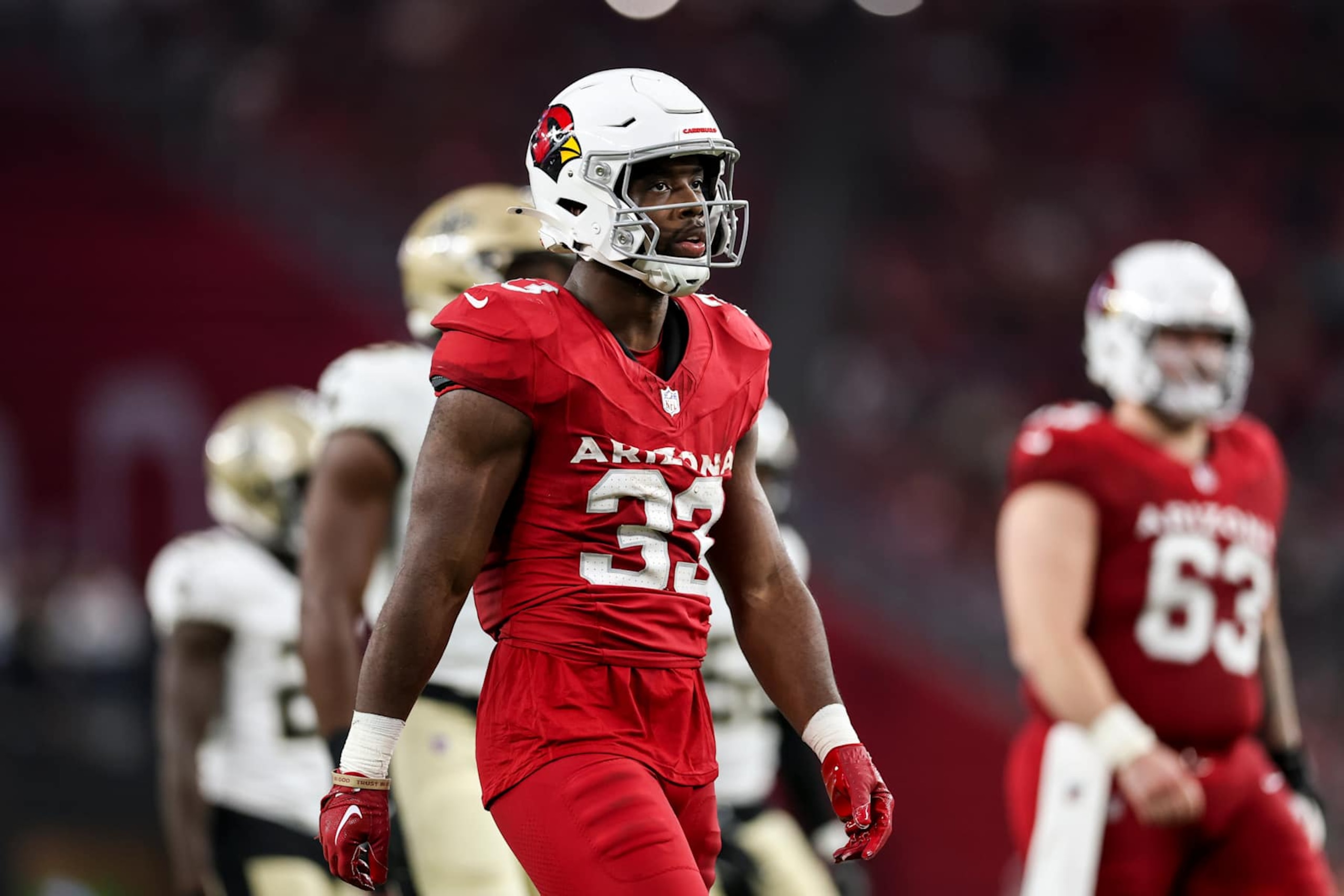 GLENDALE, AZ - AUGUST 10: Trey Benson #33 of the Arizona Cardinals walks back to the line of scrimmage during an NFL preseason football game against the New Orleans Saints, at State Farm Stadium on August 10, 2024 in Glendale, Arizona. (Photo by Brooke Sutton/Getty Images)