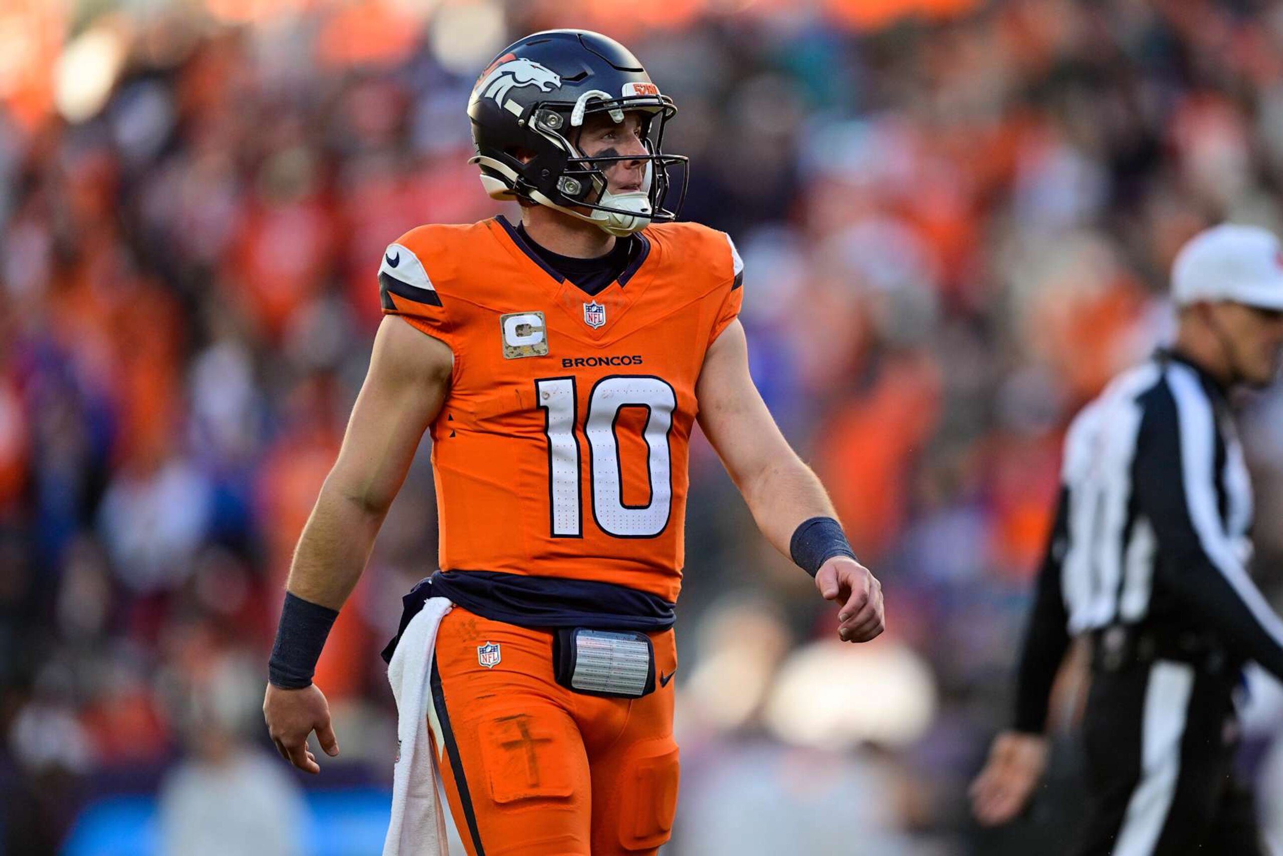 DENVER, COLORADO - NOVEMBER 17: Bo Nix #10 of the Denver Broncos looks on after a touchdown pass in the third quarter against the Atlanta Falcons at Empower Field at Mile High on November 17, 2024 in Denver, Colorado. (Photo by Dustin Bradford/Getty Images) DENVER, COLORADO - NOVEMBER 17: Bo Nix #10 of the Denver Broncos looks on after a touchdown pass in the third quarter against the Atlanta Falcons at Empower Field at Mile High on November 17, 2024 in Denver, Colorado. (Photo by Dustin Bradford/Getty Images)