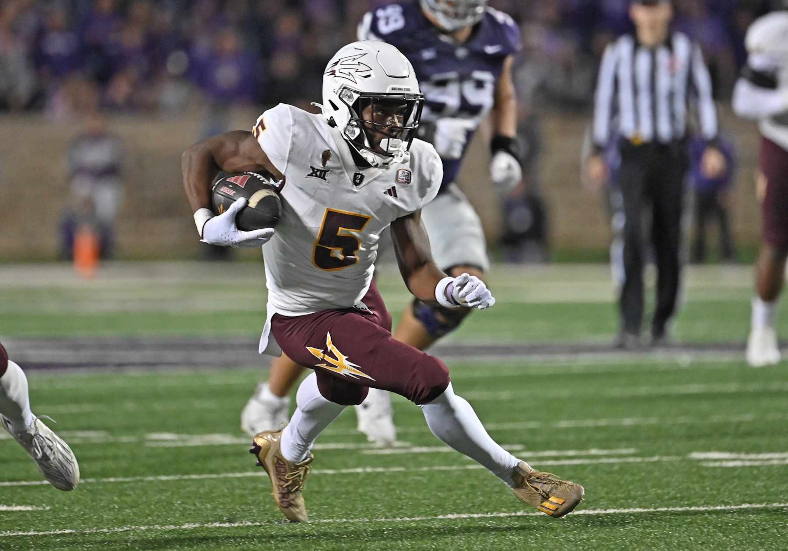 MANHATTAN, KS - NOVEMBER 16: Wide receiver Melquan Stovall #5 of the Arizona State Sun Devils runs with the ball after catching a pass in the second half against the Kansas State Wildcats at Bill Snyder Family Football Stadium on November 16, 2024 in Manhattan, Kansas. (Photo by Peter G. Aiken/Getty Images)