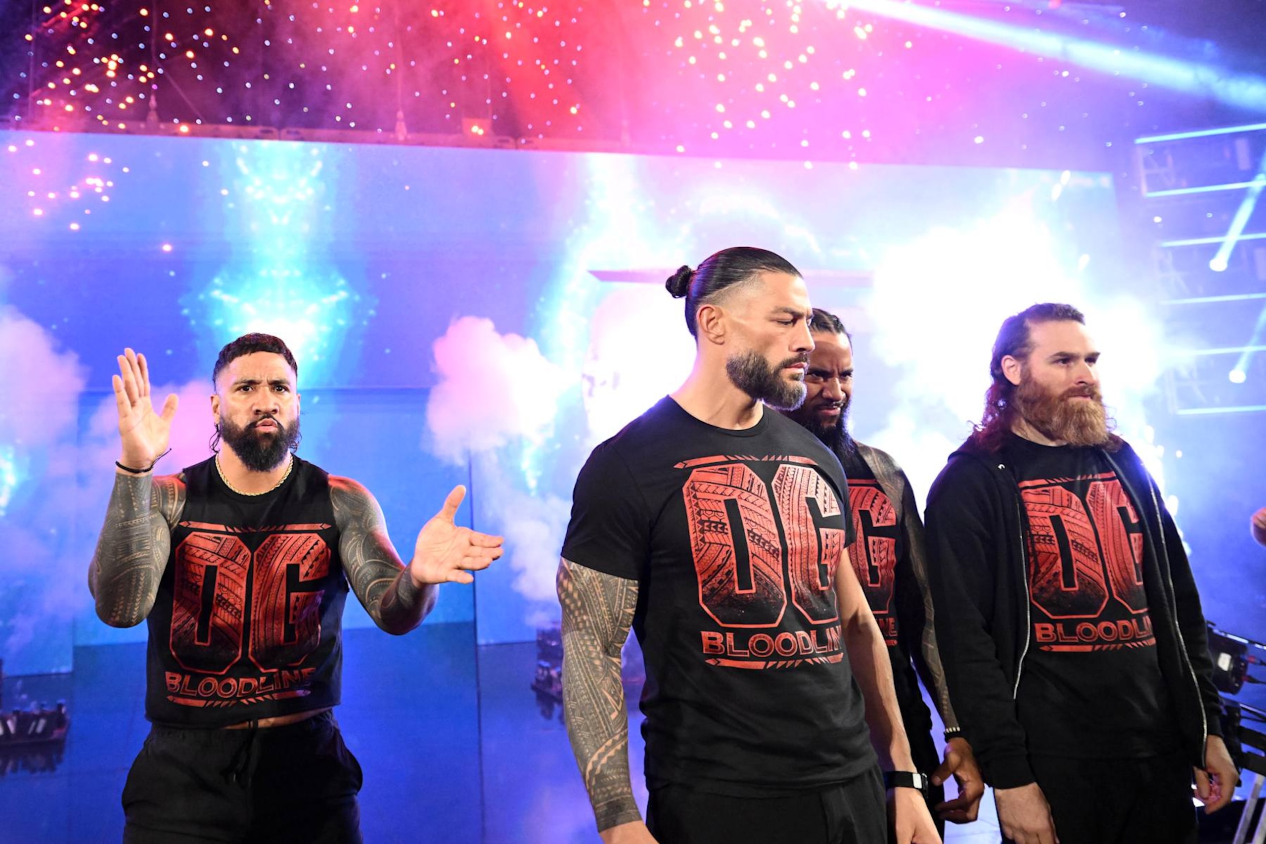 MILWAUKEE, WISCONSIN - NOVEMBER 15: (L-R) Jey Uso, Roman Reigns, Jimmy Uso and Sami Zayn of the OG Bloodline make their entrance during WWE SmackDown at Fiserv Forum on November 15, 2024 in Milwaukee, Wisconsin.  (Photo by WWE/Getty Images)