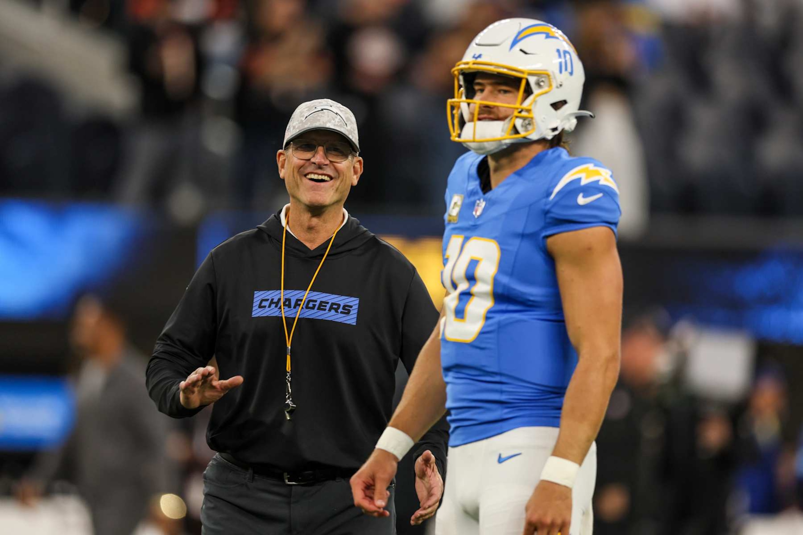 Inglewood, CA, Sunday, November 17, 2024 - Chargers head coach Jim Harbaugh with Justin Herbert during pregame warmups before a game against the Cincinnati Bengals at SoFi Stadium. (Robert Gauthier/Los Angeles Times via Getty Images)