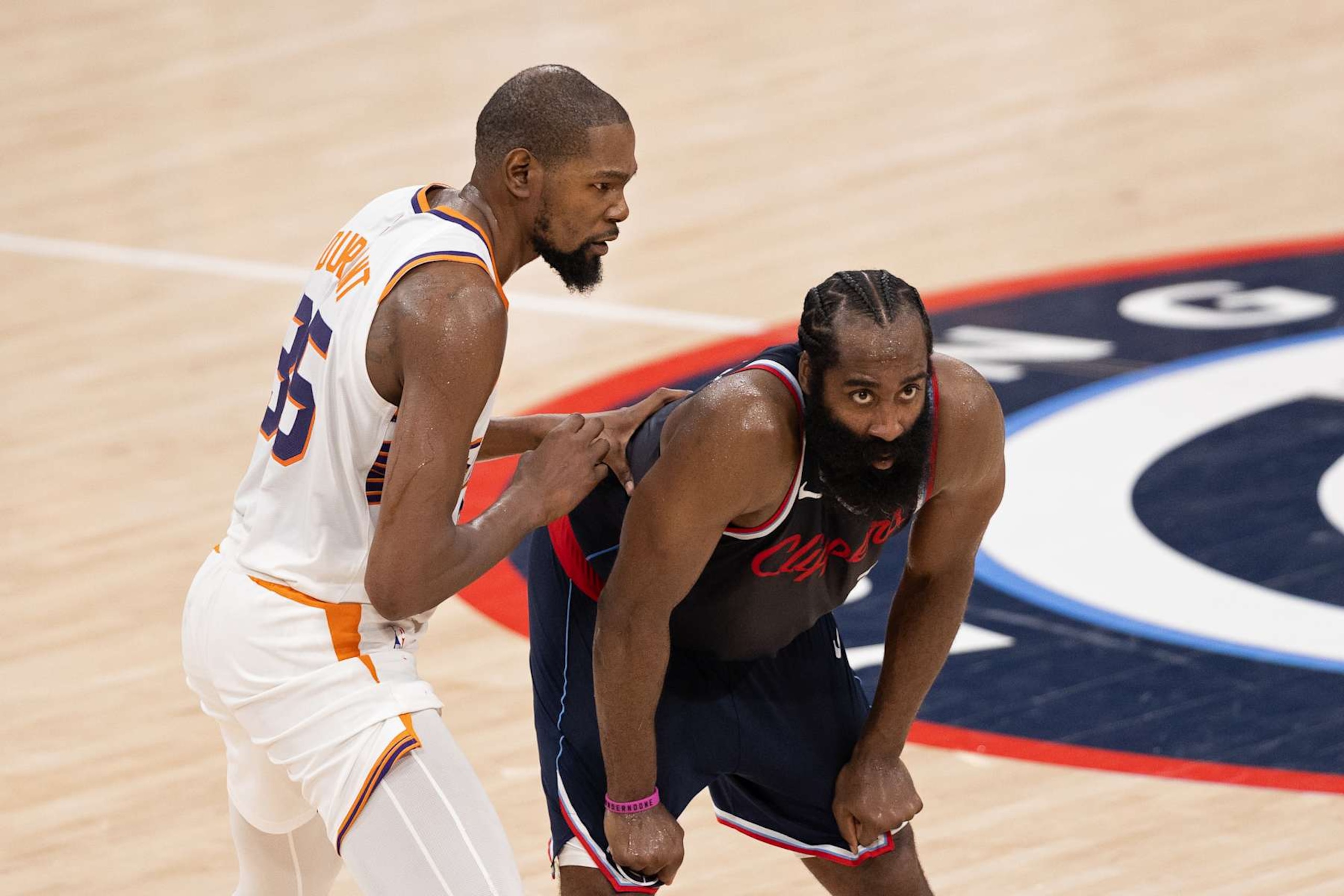 INGLEWOOD, CA - OCTOBER 23: Kevin Durant #35 of the Phoenix Suns and James Harden #1 of the LA Clippers look on during the game on October 23, 2024 at Intuit Dome in Los Angeles, California. NOTE TO USER: User expressly acknowledges and agrees that, by downloading and/or using this Photograph, user is consenting to the terms and conditions of the Getty Images License Agreement. Mandatory Copyright Notice: Copyright 2024 NBAE (Photo by Joseph Baura/NBAE via Getty Images)