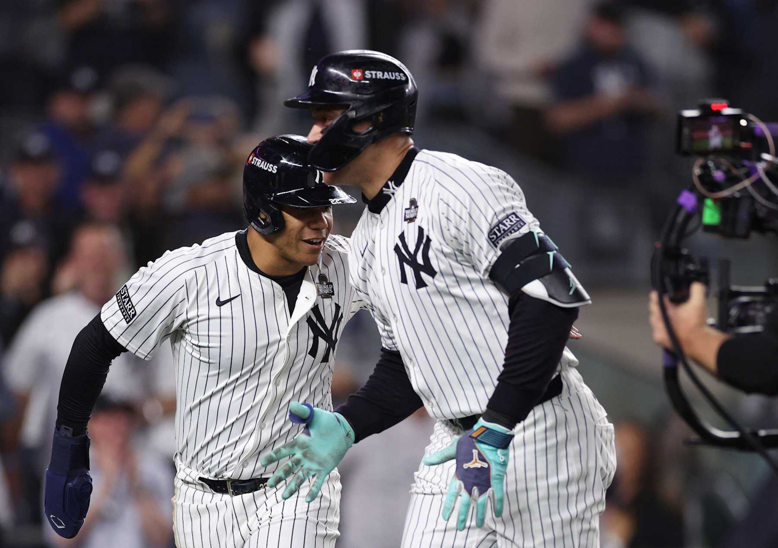 NEW YORK, NEW YORK - OCTOBER 30:  Aaron Judge #99 of the New York Yankees is congratulated by Juan Soto #22 after hitting a two-run home run during the first inning of Game Five of the 2024 World Series against the Los Angeles Dodgers at Yankee Stadium on October 30, 2024 in the Bronx borough of New York City. (Photo by Elsa/Getty Images)