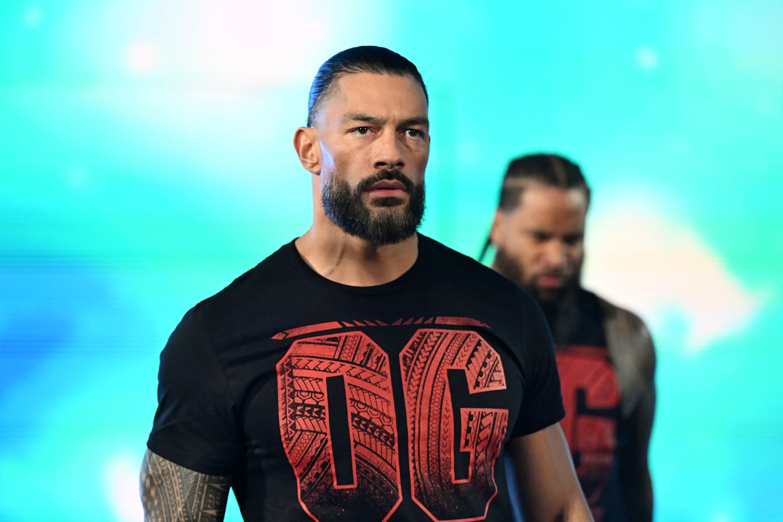 MILWAUKEE, WISCONSIN - NOVEMBER 15: Roman Reigns (L) and Jimmy Uso make their entrance during WWE SmackDown at Fiserv Forum on November 15, 2024 in Milwaukee, Wisconsin.  (Photo by WWE/Getty Images)