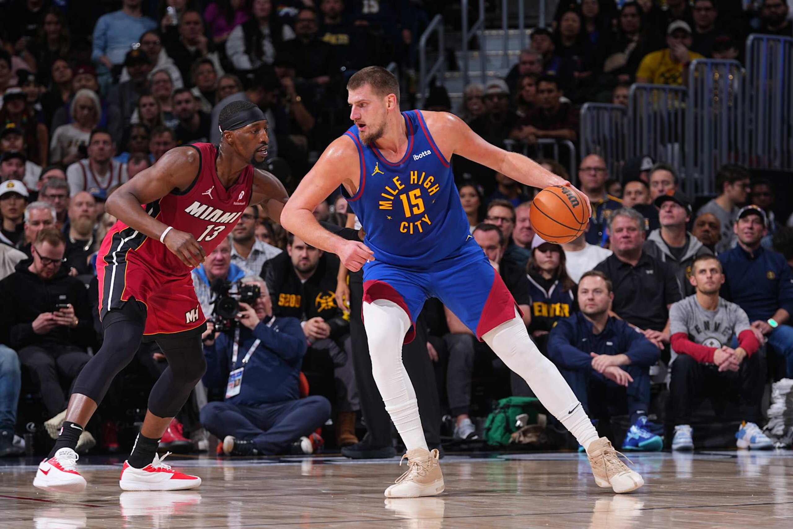 DENVER, CO - NOVEMBER 8: Nikola Jokic #15 of the Denver Nuggets dribbles the ball during the game against the Miami Heat on November 8, 2024 at Ball Arena in Denver, Colorado. NOTE TO USER: User expressly acknowledges and agrees that, by downloading and/or using this Photograph, user is consenting to the terms and conditions of the Getty Images License Agreement. Mandatory Copyright Notice: Copyright 2024 NBAE (Photo by Bart Young/NBAE via Getty Images) DENVER, CO - NOVEMBER 8: Nikola Jokic #15 of the Denver Nuggets dribbles the ball during the game against the Miami Heat on November 8, 2024 at Ball Arena in Denver, Colorado. NOTE TO USER: User expressly acknowledges and agrees that, by downloading and/or using this Photograph, user is consenting to the terms and conditions of the Getty Images License Agreement. Mandatory Copyright Notice: Copyright 2024 NBAE (Photo by Bart Young/NBAE via Getty Images)
