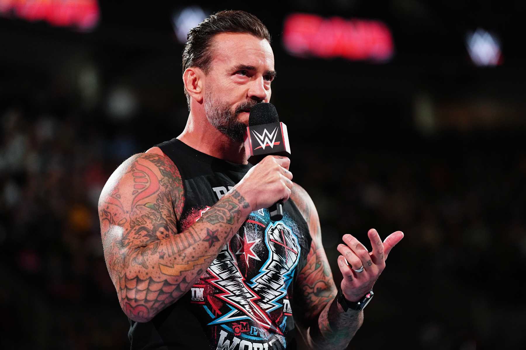 PORTLAND, OREGON - SEPTEMBER 16: CM Punk addresses the crowd during Monday Night RAW at Moda Center on September 16, 2024 in Portland, Oregon.  (Photo by WWE/Getty Images)