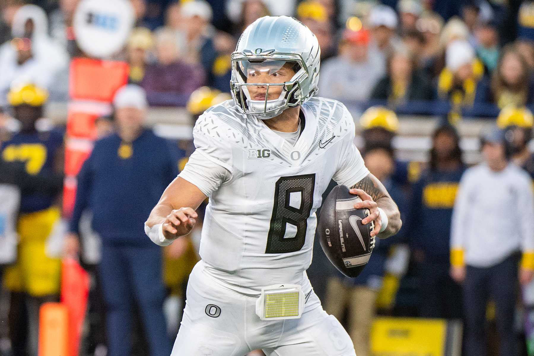 ANN ARBOR, MICHIGAN - NOVEMBER 02: Dillon Gabriel #8 of the Oregon Ducks looks to throw the ball downfield during the second half of a college football game against the Michigan Wolverines at Michigan Stadium on November 02, 2024 in Ann Arbor, Michigan. The Oregon Ducks won the game 38-17. (Photo by Aaron J. Thornton/Getty Images)