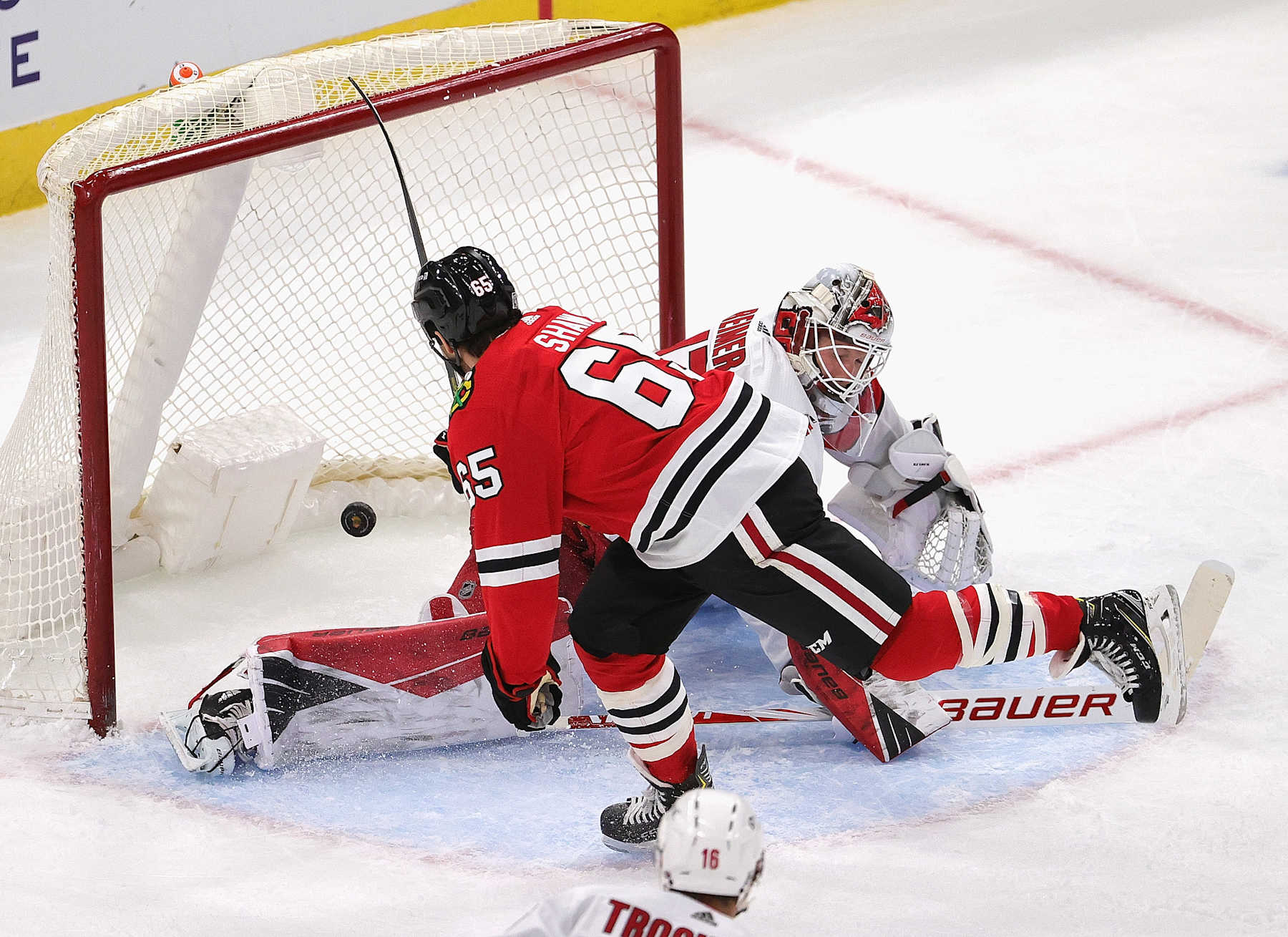 CHICAGO, ILLINOIS - FEBRUARY 04: Andrew Shaw #65 of the Chicago Blackhawks scores a goal late in the first period against James Reimer #47 of the Carolina Hurricanes at the United Center on February 04, 2021 in Chicago, Illinois. (Photo by Jonathan Daniel/Getty Images)