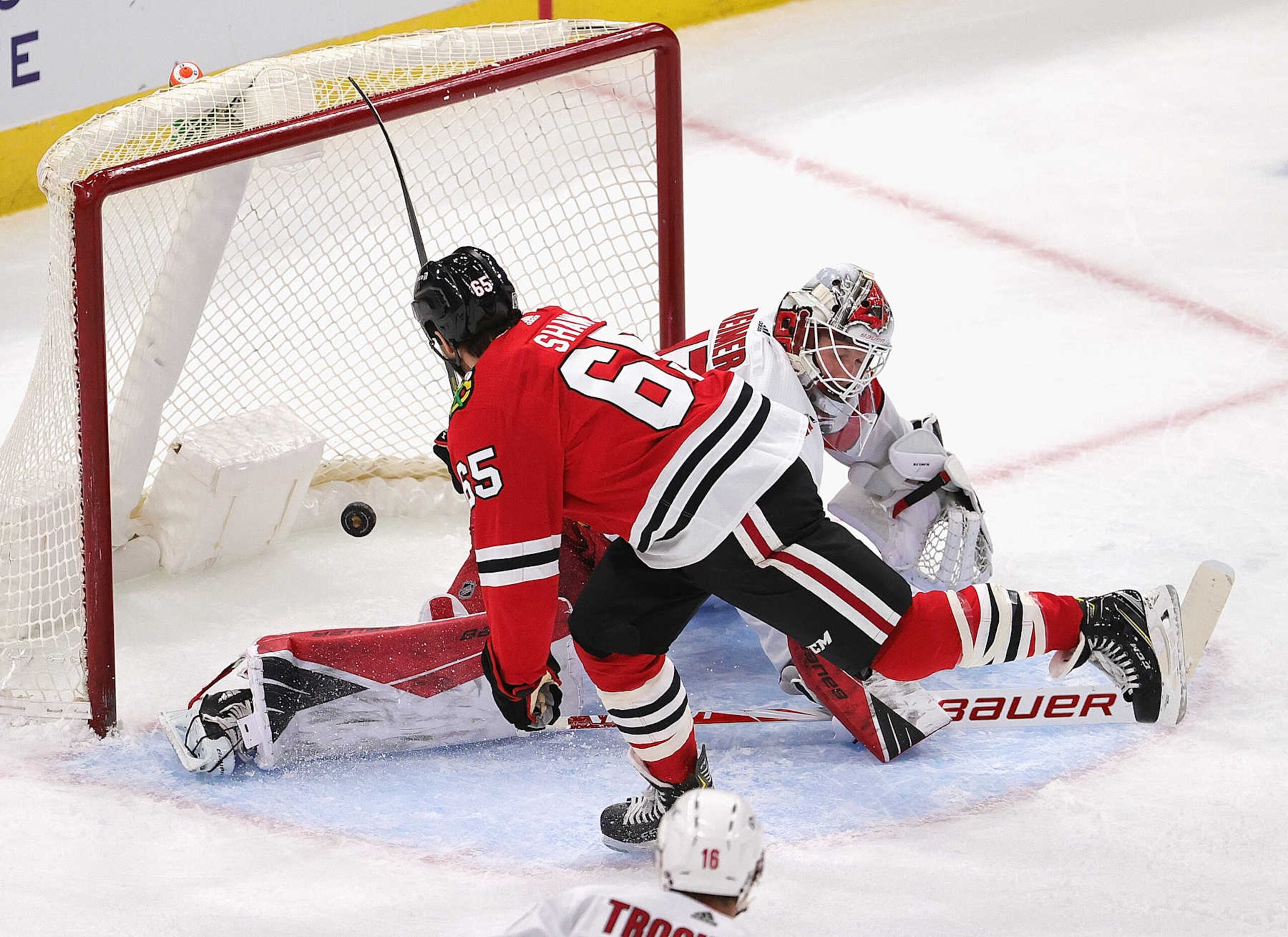 CHICAGO, ILLINOIS - FEBRUARY 04: Andrew Shaw #65 of the Chicago Blackhawks scores a goal late in the first period against James Reimer #47 of the Carolina Hurricanes at the United Center on February 04, 2021 in Chicago, Illinois. (Photo by Jonathan Daniel/Getty Images)