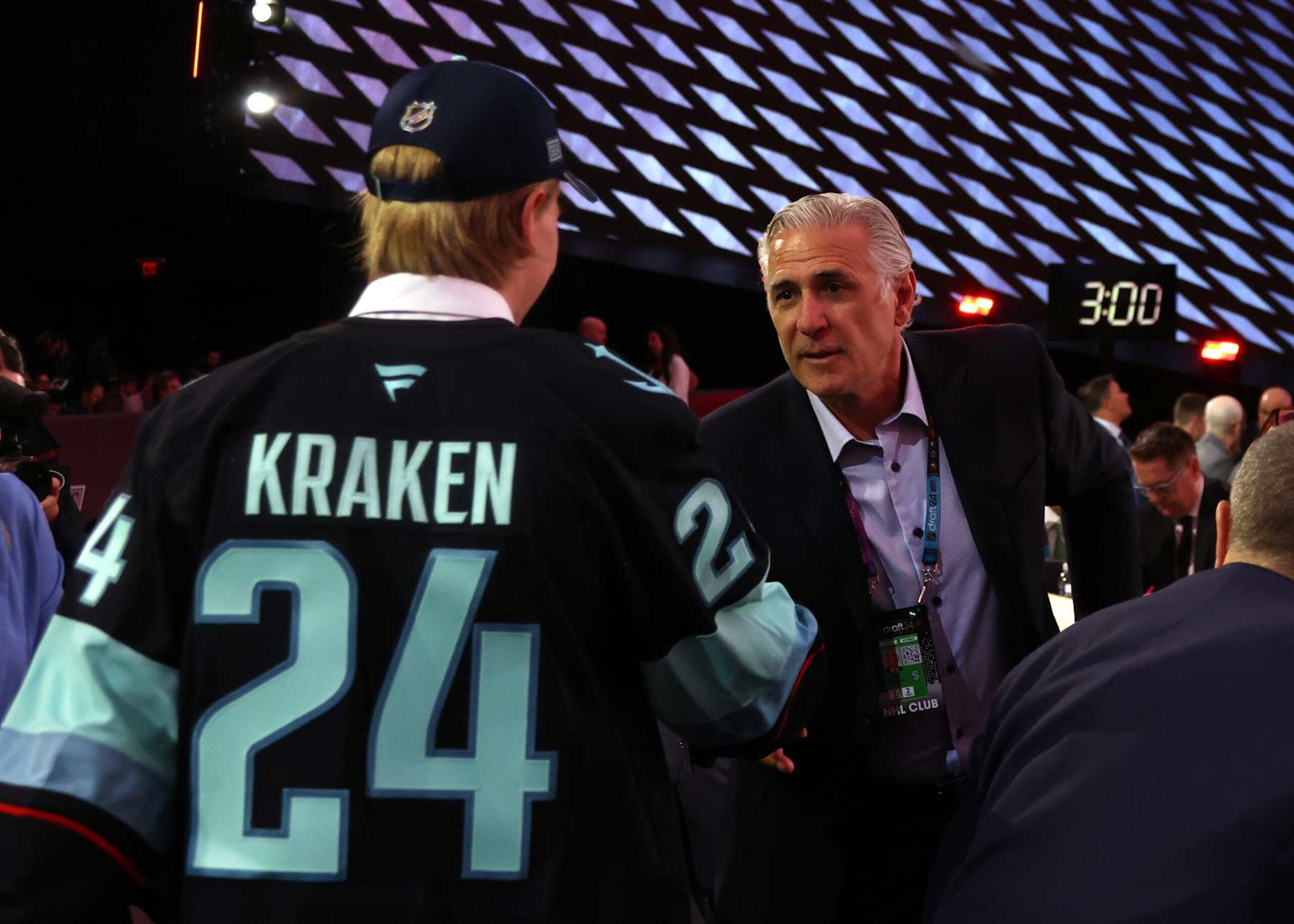 LAS VEGAS, NEVADA - JUNE 29: Julius Miettinen shakes the hand of general manager Ron Francis after being selected 40th overall by the Seattle Kraken during the 2024 Upper Deck NHL Draft Rounds 2-7 at Sphere on June 29, 2024 in Las Vegas, Nevada. (Photo by Dave Sandford/NHLI via Getty Images)