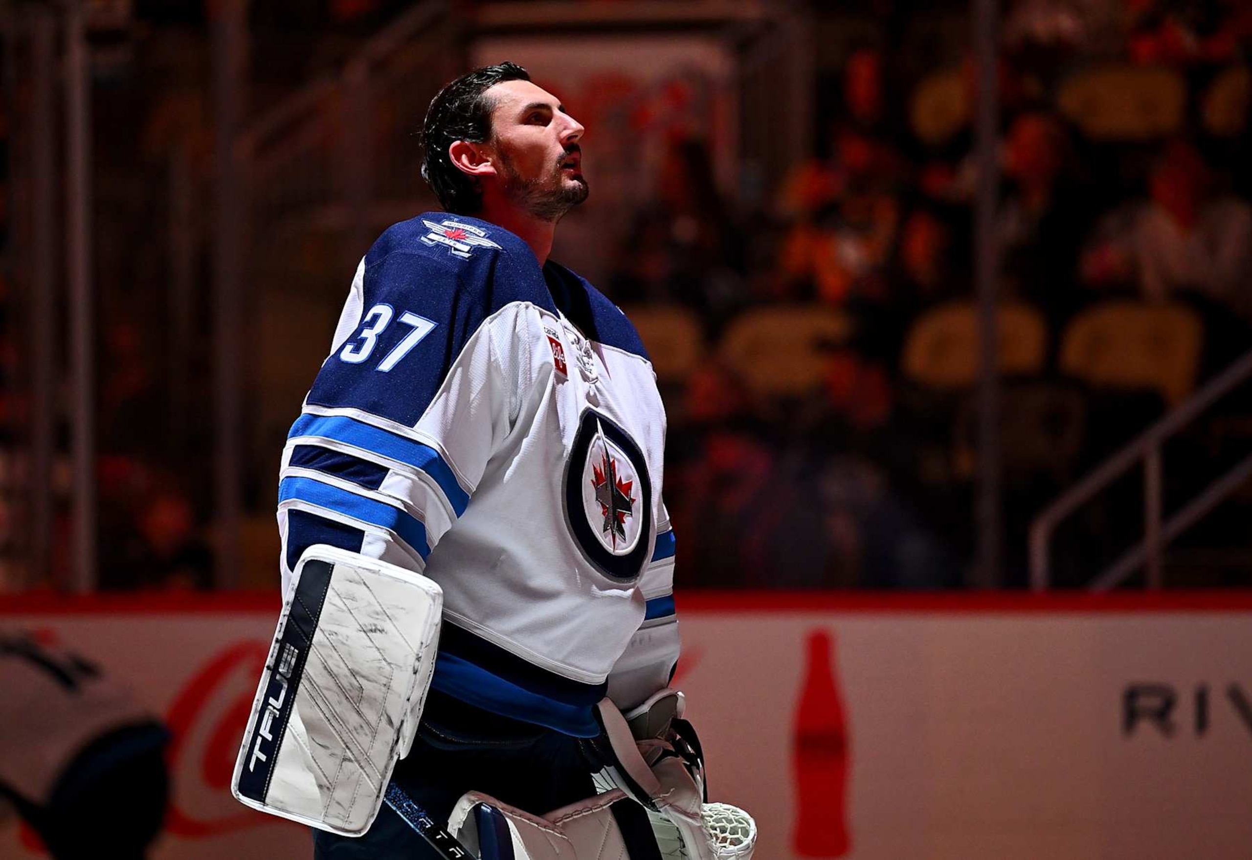 PITTSBURGH, PA - NOVEMBER 22:  Connor Hellebuyck #37 of the Winnipeg Jets stands during the National Anthem against the Pittsburgh Penguins at PPG PAINTS Arena on November 22, 2024 in Pittsburgh, Pennsylvania. (Photo by Joe Sargent/NHLI via Getty Images)