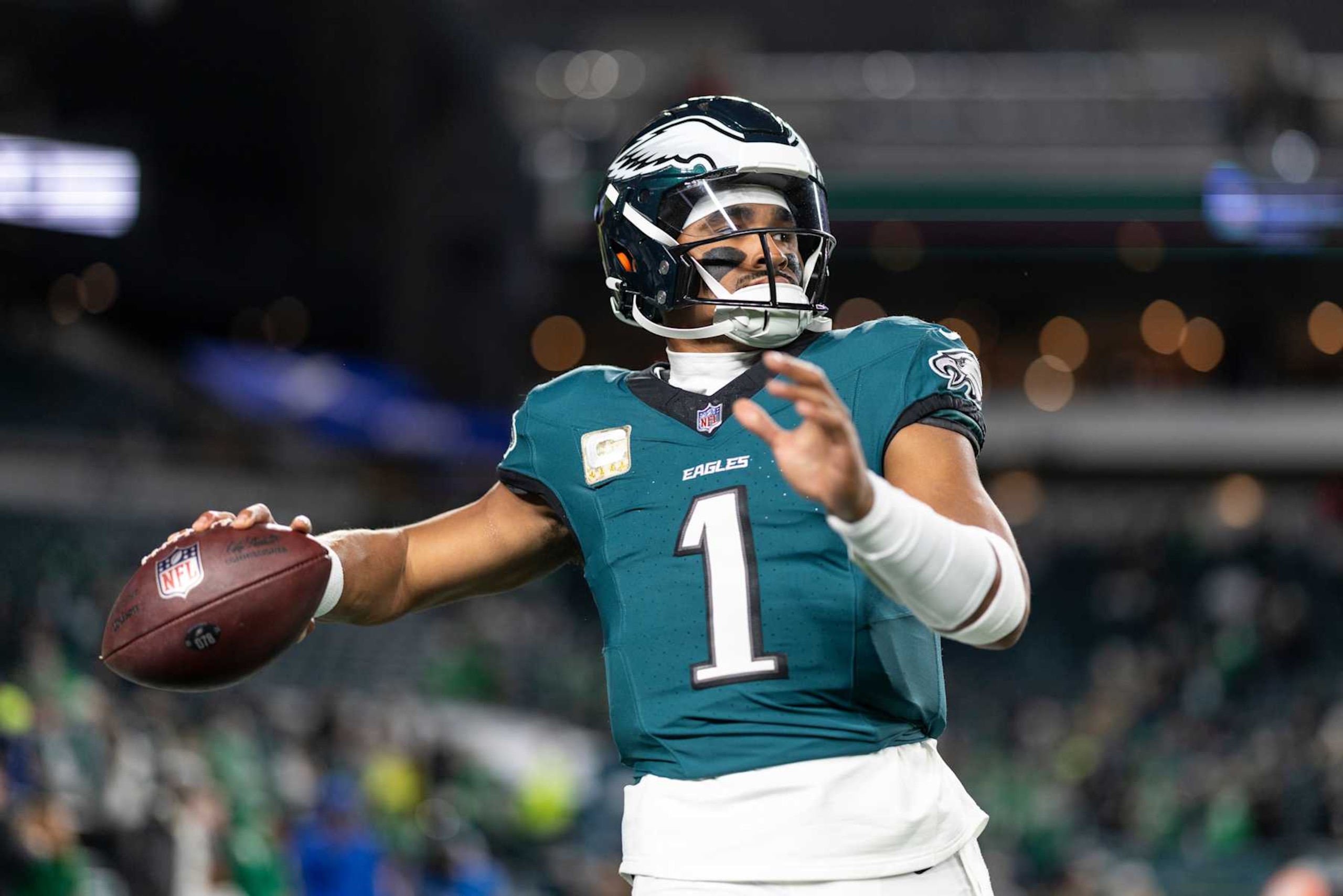 PHILADELPHIA, PENNSYLVANIA - NOVEMBER 14: Jalen Hurts #1 of the Philadelphia Eagles looks to pass prior to an NFL Football game against the Washington Commanders at Lincoln Financial Field on November 14, 2024 in Philadelphia, Pennsylvania. (Photo by Michael Owens/Getty Images)