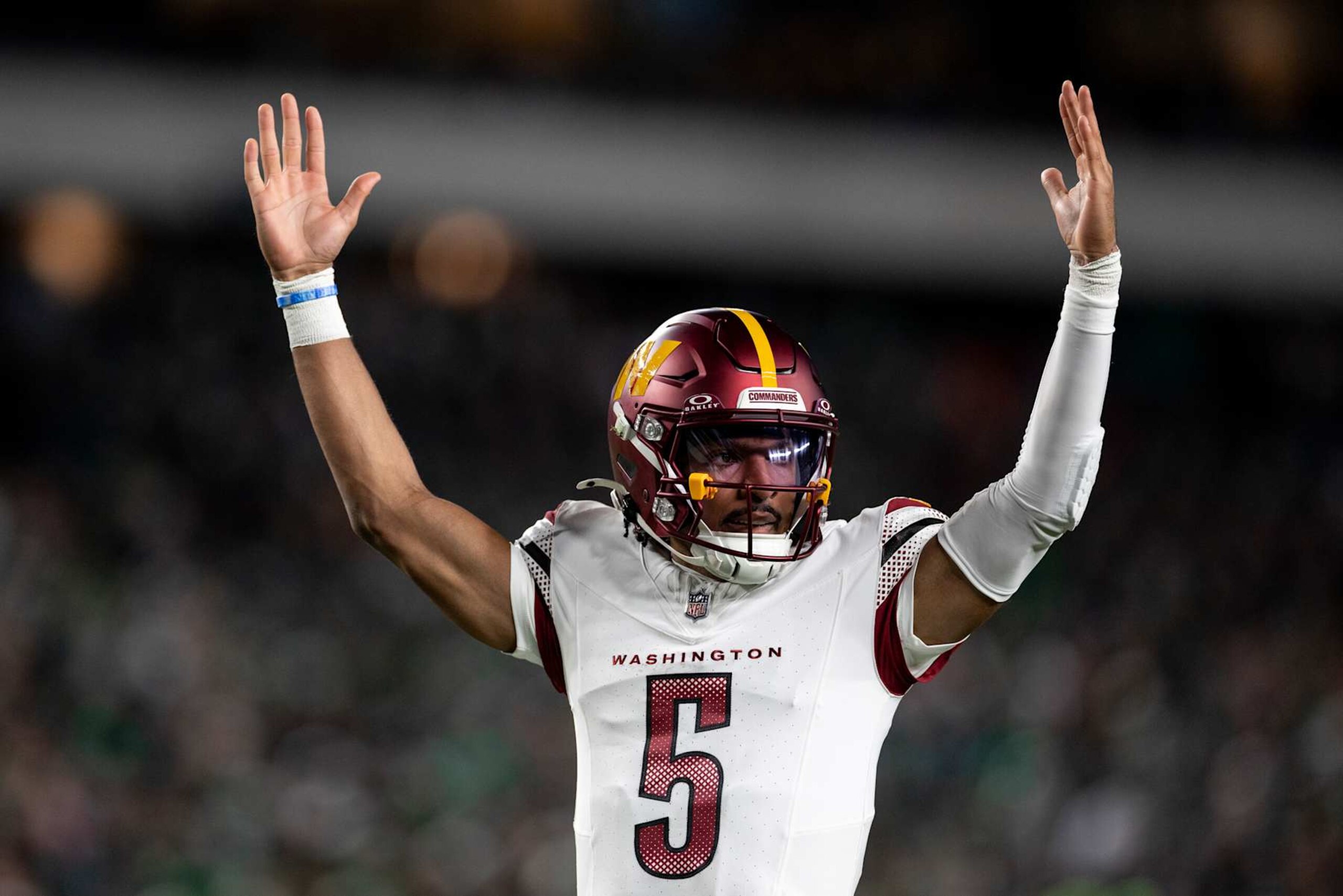 PHILADELPHIA, PENNSYLVANIA - NOVEMBER 14: Jayden Daniels #5 of the Washington Commanders celebrates after a touchdown during an NFL Football game against the Philadelphia Eagles at Lincoln Financial Field on November 14, 2024 in Philadelphia, Pennsylvania. (Photo by Michael Owens/Getty Images)