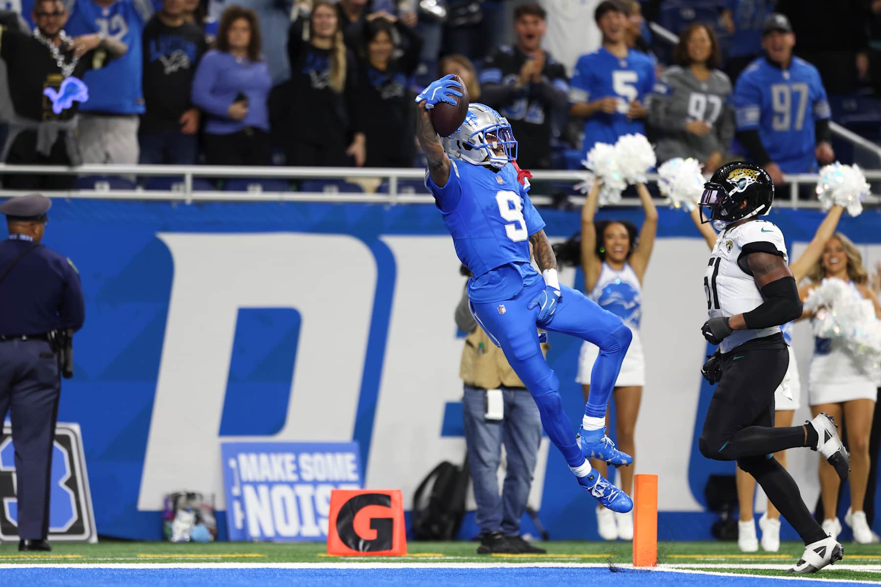 DETROIT, MICHIGAN - NOVEMBER 17: Jameson Williams #9 of the Detroit Lions scores a touchdown as Ventrell Miller #51 of the Jacksonville Jaguars defends during a game at Ford Field on November 17, 2024 in Detroit, Michigan. The Lions defeated the Jaguars 52-6. (Kara Durrette/Getty Images)