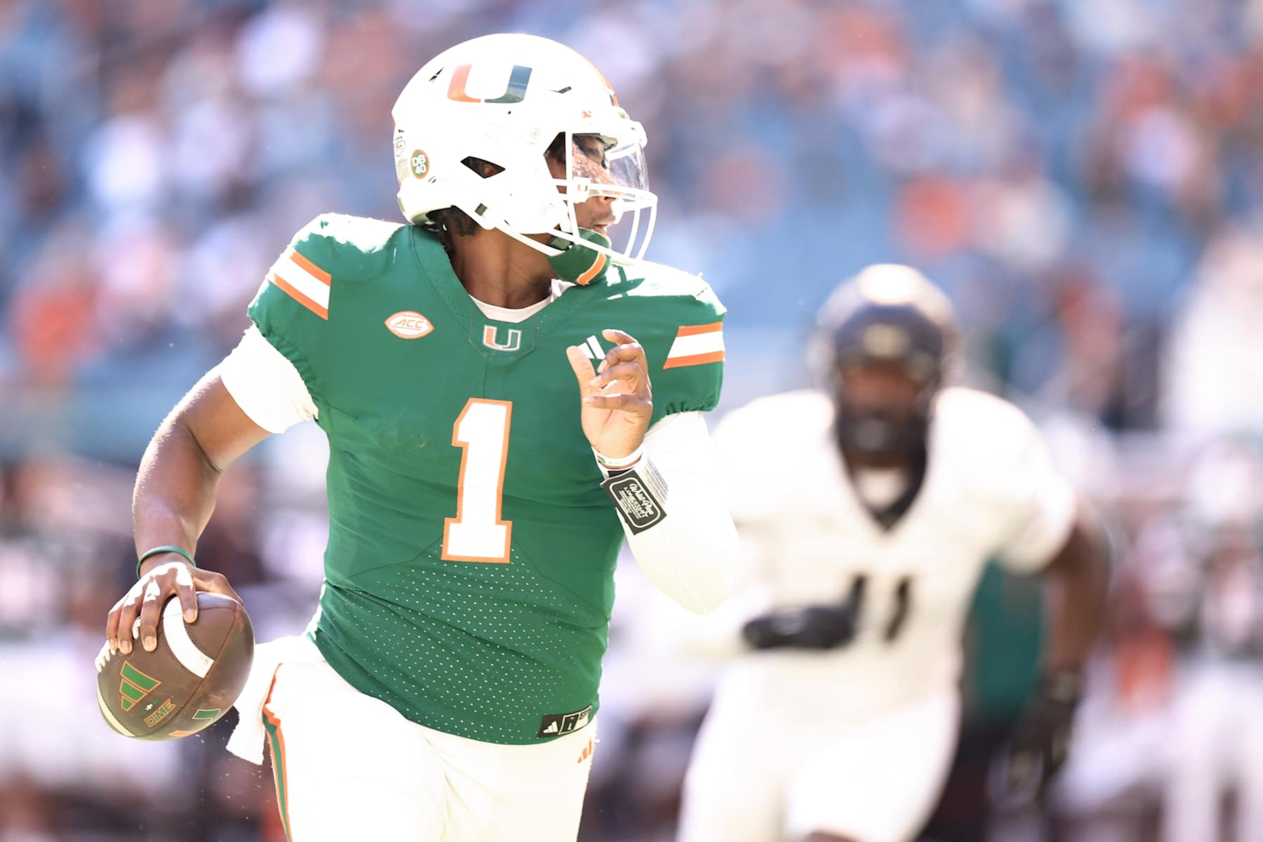 MIAMI GARDENS, FLORIDA - NOVEMBER 23: Cam Ward #1 of the Miami Hurricanes scrambles against the Wake Forest Demon Deacons during the first half at Hard Rock Stadium on November 23, 2024 in Miami Gardens, Florida. (Photo by Carmen Mandato/Getty Images) MIAMI GARDENS, FLORIDA - NOVEMBER 23: Cam Ward #1 of the Miami Hurricanes scrambles against the Wake Forest Demon Deacons during the first half at Hard Rock Stadium on November 23, 2024 in Miami Gardens, Florida. (Photo by Carmen Mandato/Getty Images)