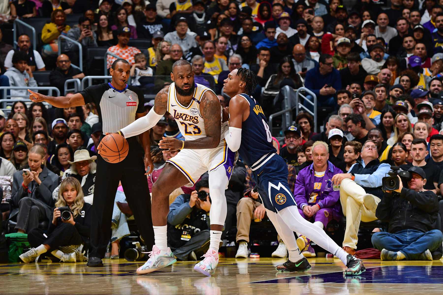 LOS ANGELES, CA - NOVEMBER 23: LeBron James #23 of the Los Angeles Lakers dribbles the ball during the game against the Denver Nuggets on November 23, 2024 at Crypto.Com Arena in Los Angeles, California. NOTE TO USER: User expressly acknowledges and agrees that, by downloading and/or using this Photograph, user is consenting to the terms and conditions of the Getty Images License Agreement. Mandatory Copyright Notice: Copyright 2024 NBAE (Photo by Adam Pantozzi/NBAE via Getty Images)