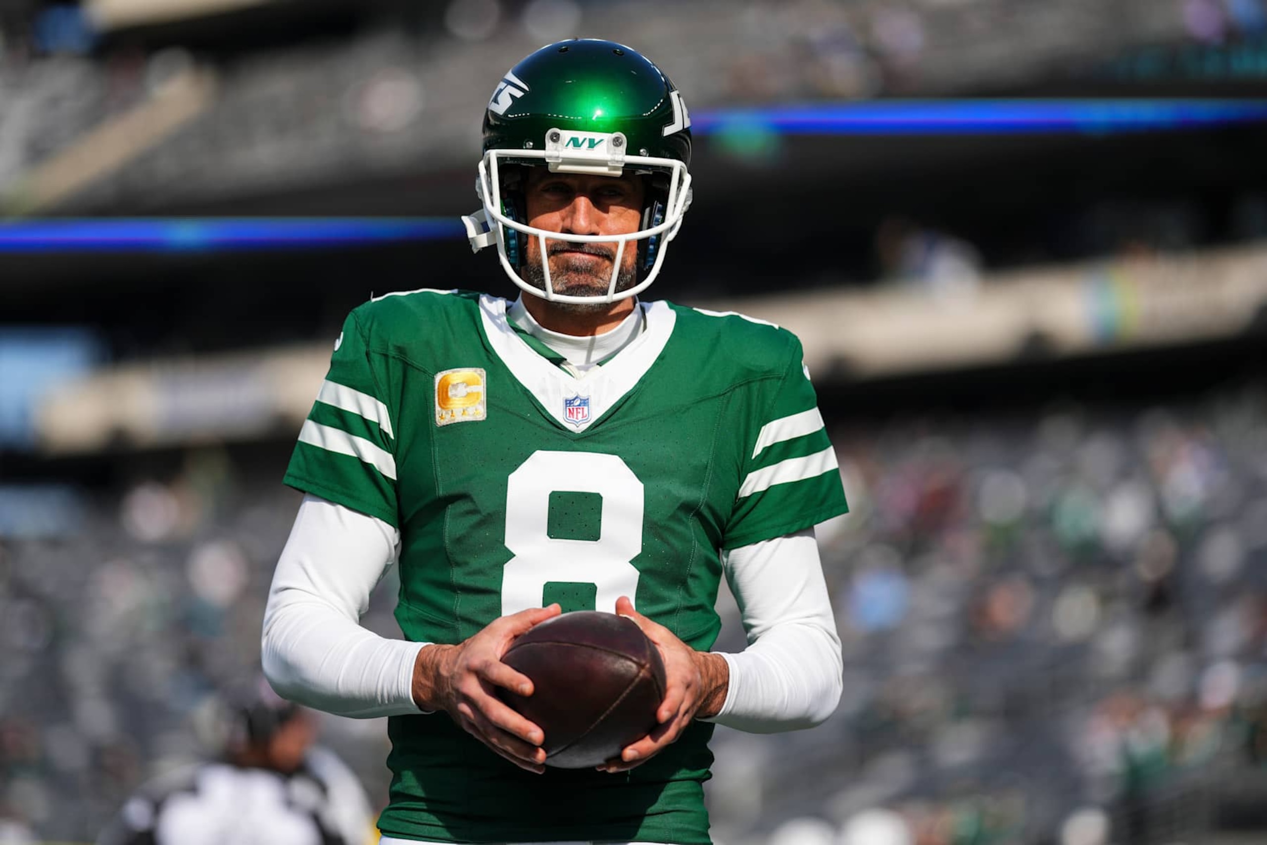 EAST RUTHERFORD, NJ - NOVEMBER 17: Aaron Rodgers #8 of the New York Jets warms up prior to an NFL football game against the Indianapolis Colts at MetLife Stadium on November 17, 2024 in East Rutherford, New Jersey. (Photo by Cooper Neill/Getty Images)