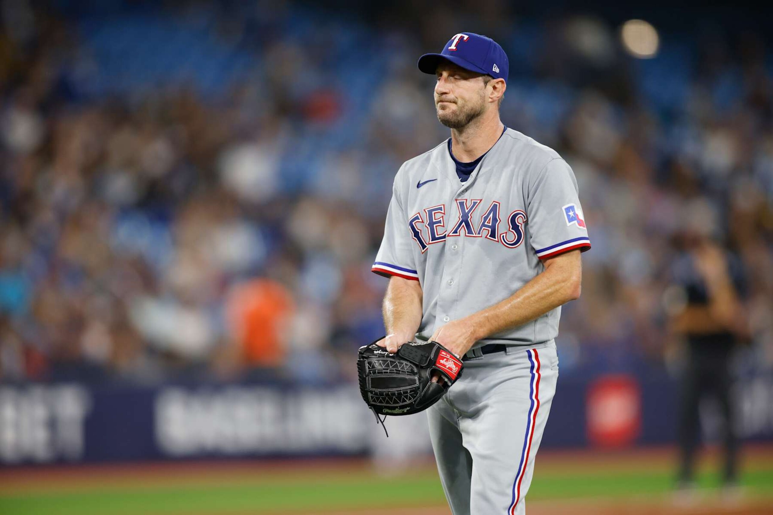 TORONTO, CANADA - SEPTEMBER 12: Max Scherzer #31 of the Texas Rangers leaves the game in the sixth inning against the Toronto Blue Jays at Rogers Centre on September 12, 2023 in Toronto, Canada. (Photo by Cole Burston/Getty Images)